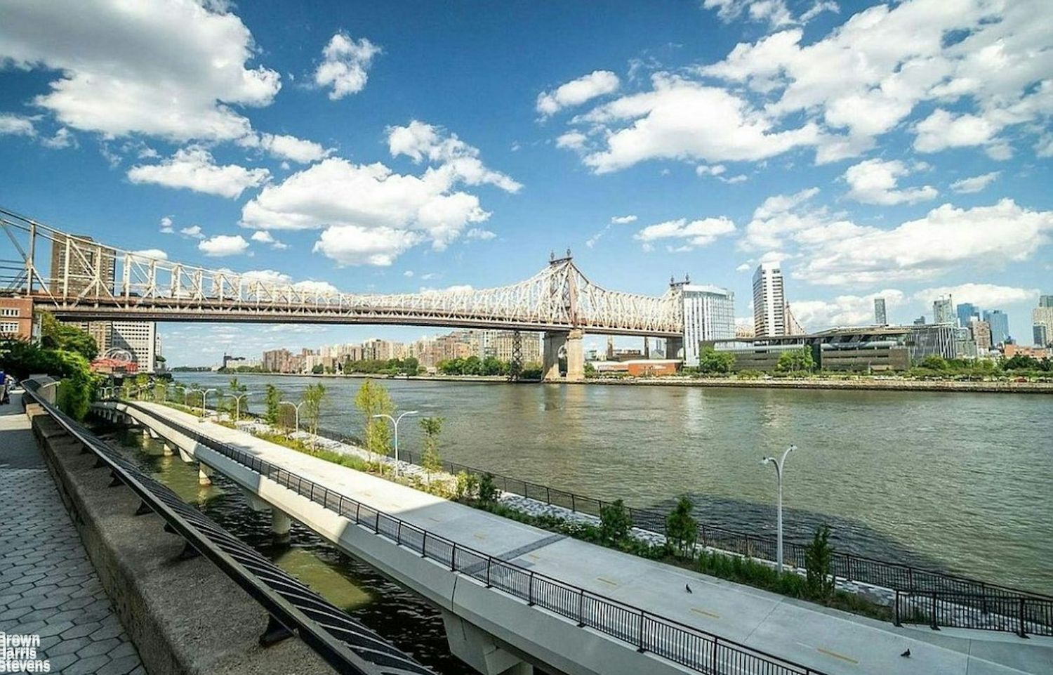 440 East 56th Street, Unit 8C Manhattan, NY 10022 - Photo 13 of 14 a view of a lake and a city