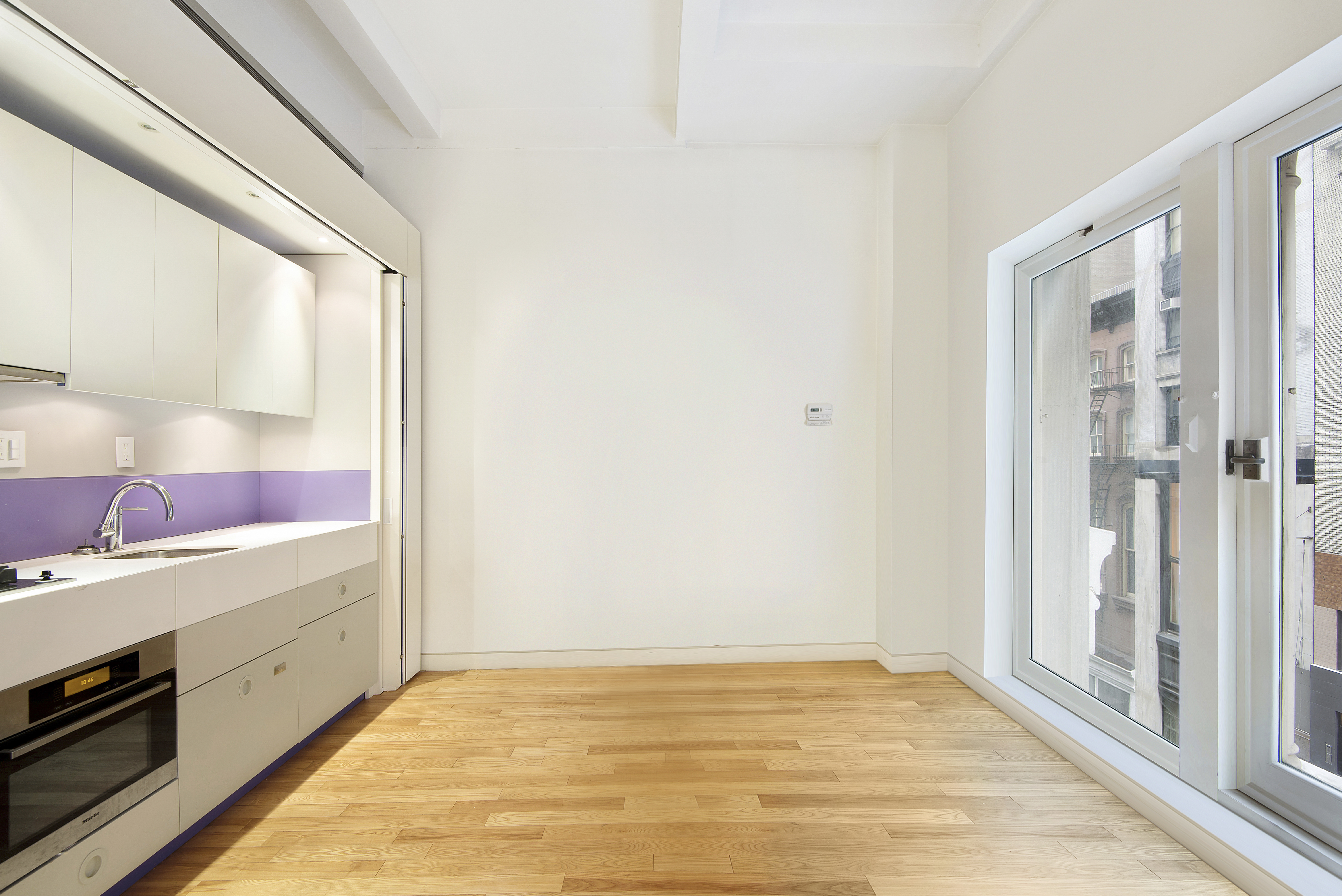 16 West 19th Street, Unit 3A Manhattan, NY 10011 - Photo 6 of 8 a view of an empty room and window