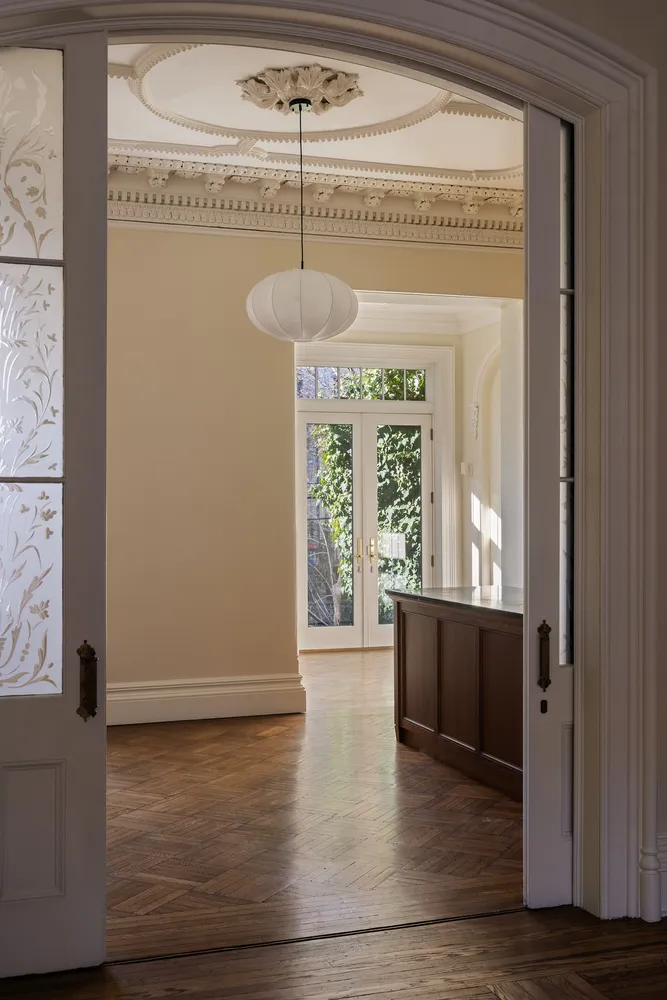 a view of room with window and wooden floor