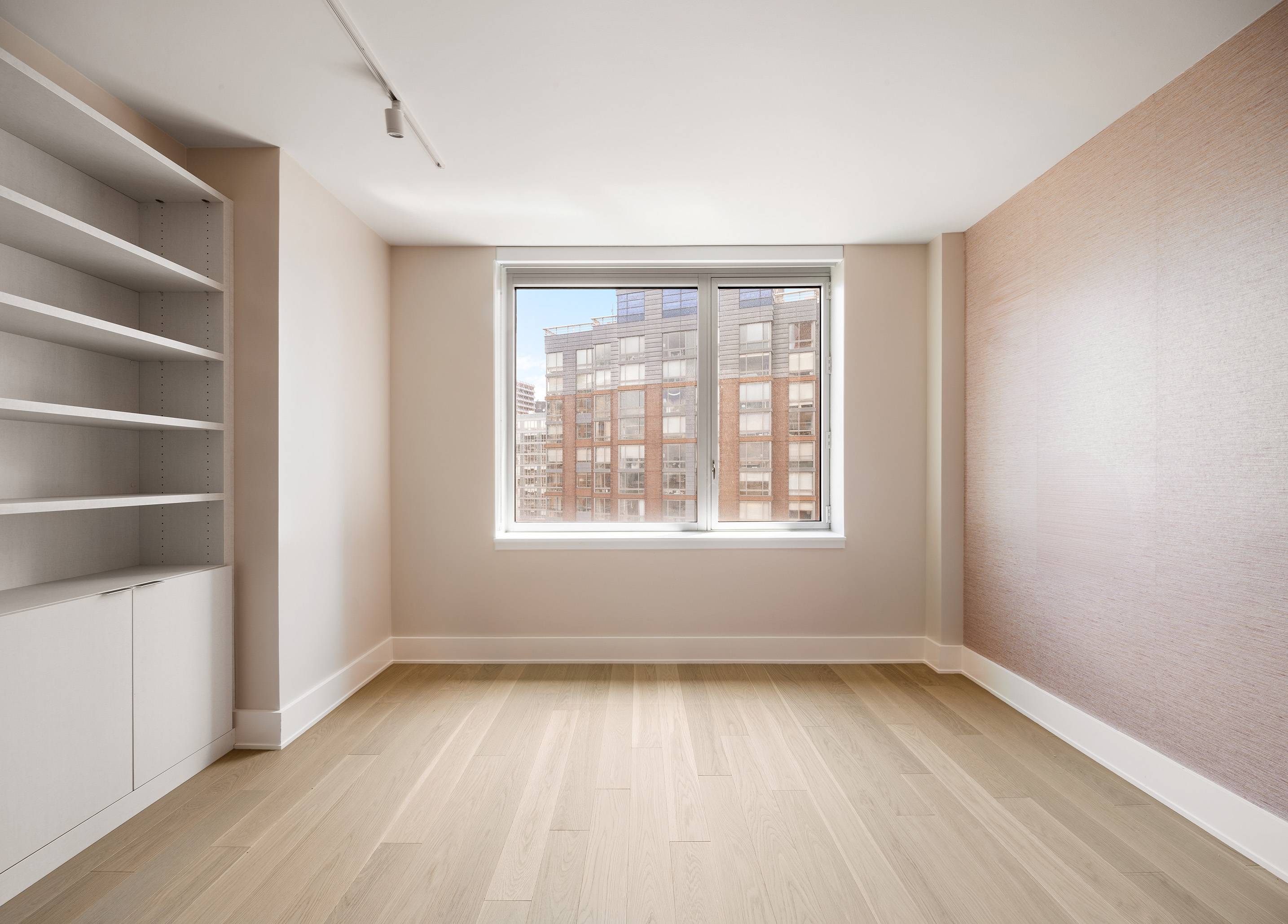 20 River Terrace, Unit 22A Manhattan, NY 10282 - Photo 8 of 27 an empty room with a empty space and a window