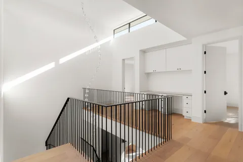 a view of an empty room with windows