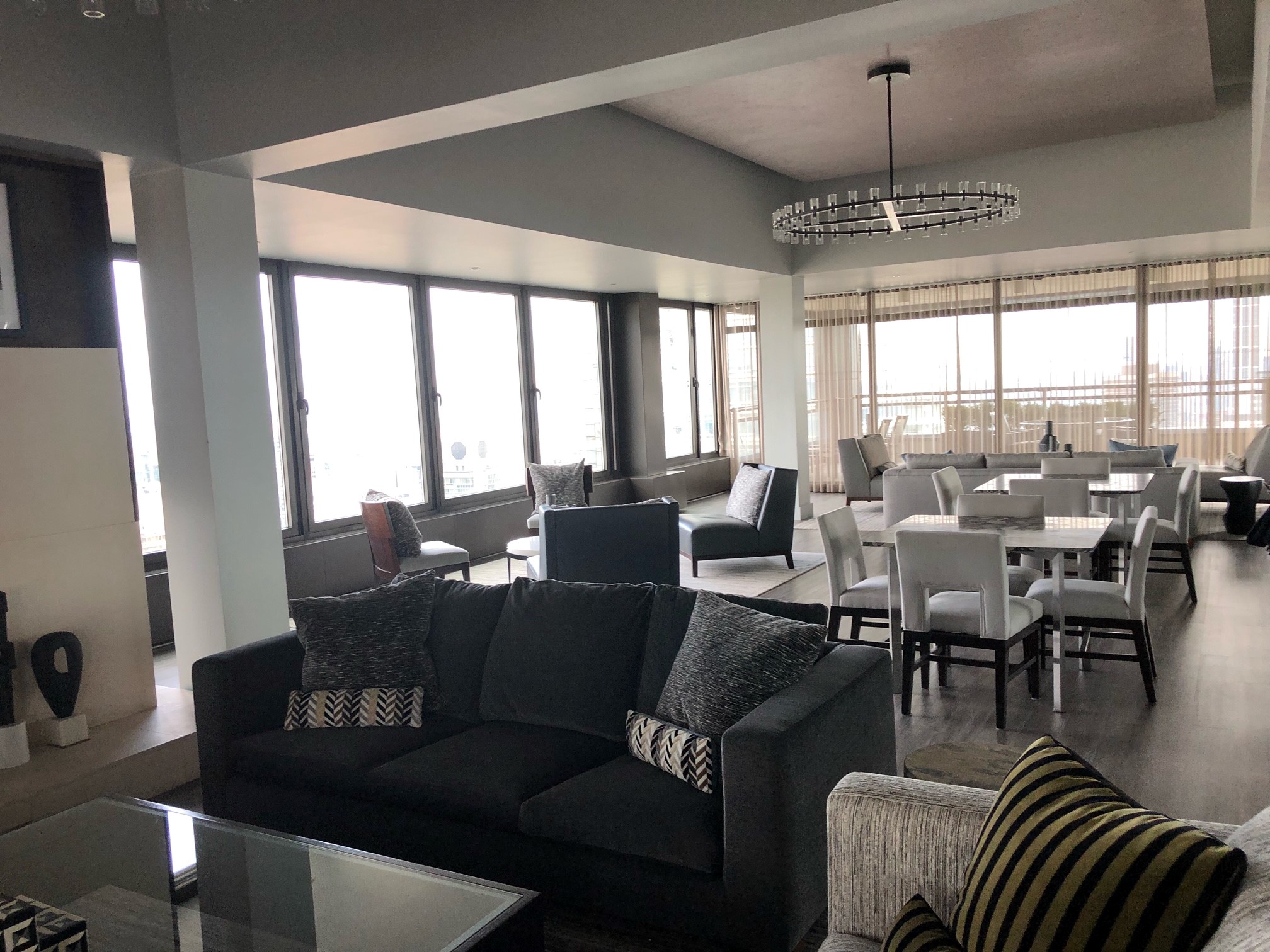 117 East 57th Street, Unit 21H Manhattan, NY 10022 - Photo 23 of 26 a dining room with furniture a chandelier and window