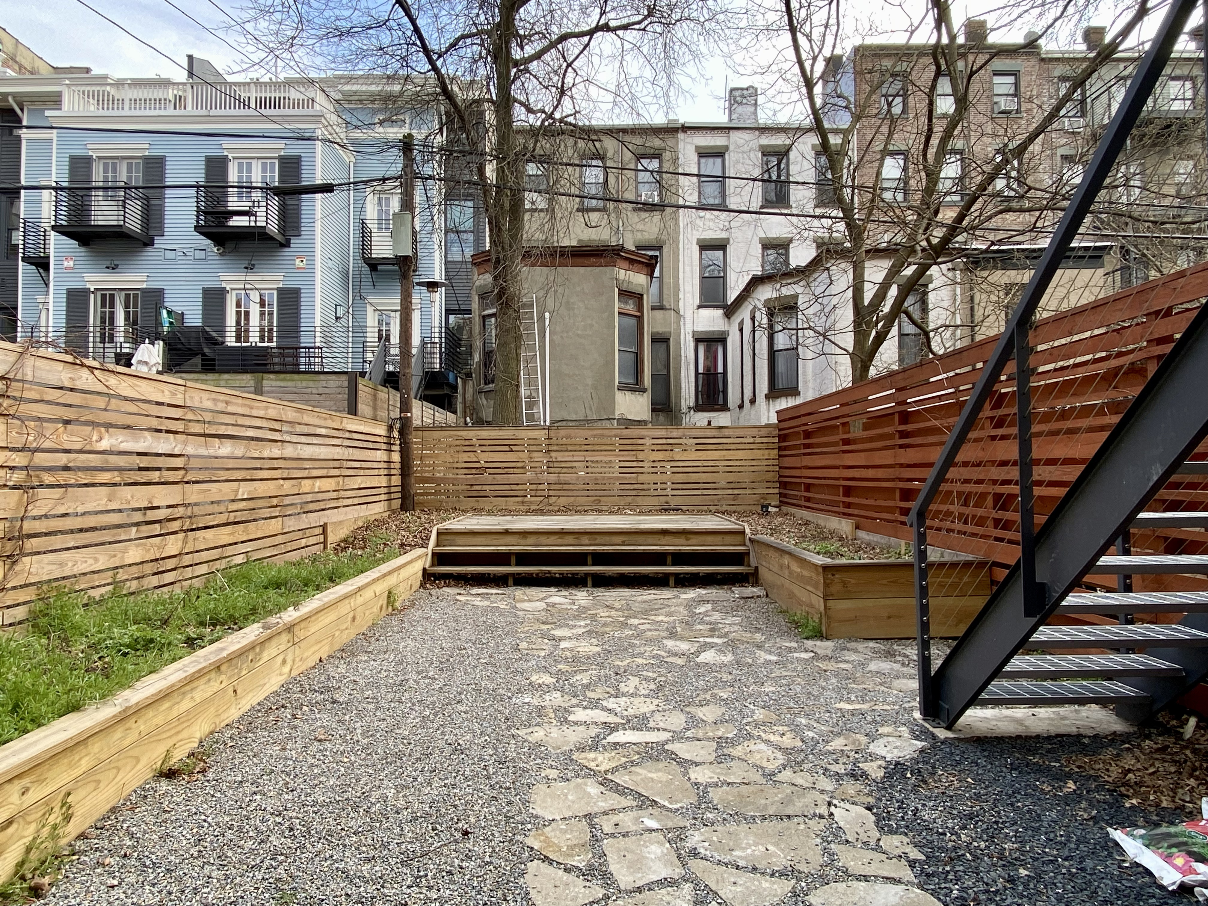 1420 Pacific Street, Unit 1 Brooklyn, NY 11216 - Photo 10 of 30 a view of a building with a bench