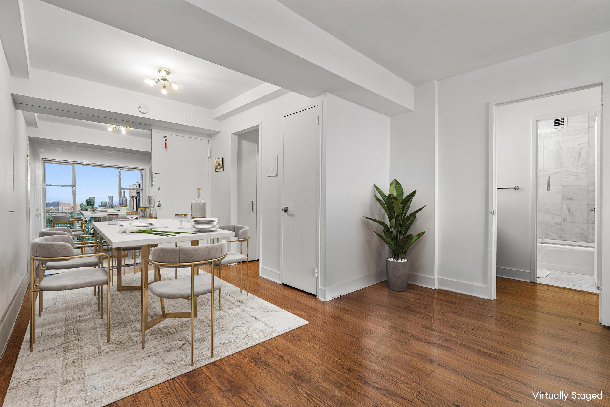 117 East 57th Street, Unit 48G Manhattan, NY 10022 - Photo 2 of 13 a view of a dining room with furniture and wooden floor