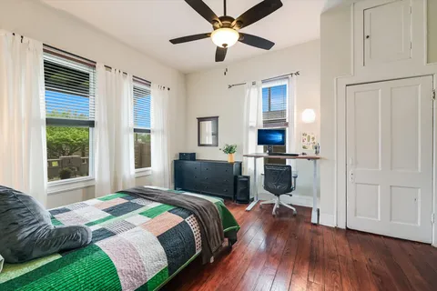 a bedroom with a bed and a chandelier
