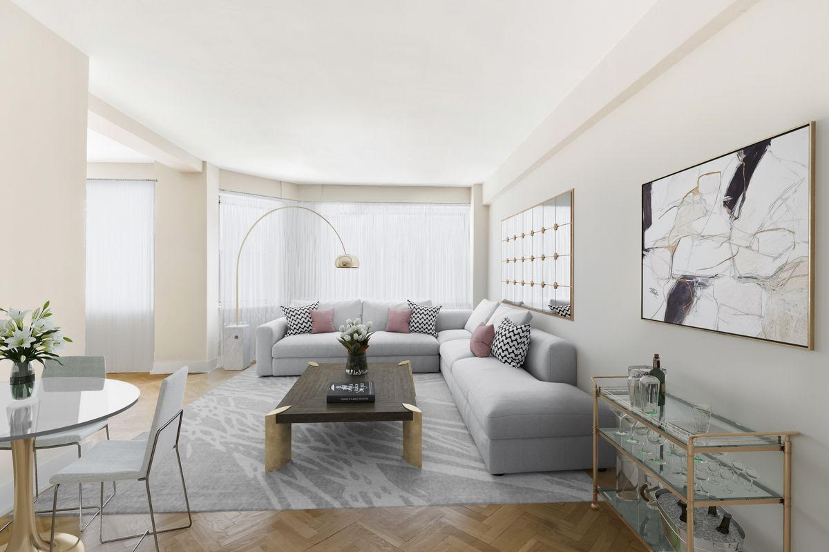 a living room with furniture and a potted plant