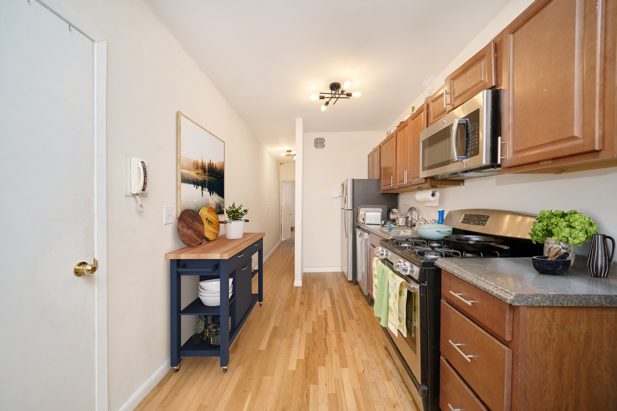 105 West 105th Street, Unit 3B Manhattan, NY 10025 - Photo 4 of 4 a kitchen with stainless steel appliances granite countertop a stove a sink dishwasher and a refrigerator