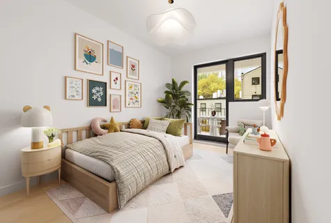 a bedroom with a bed and a large window