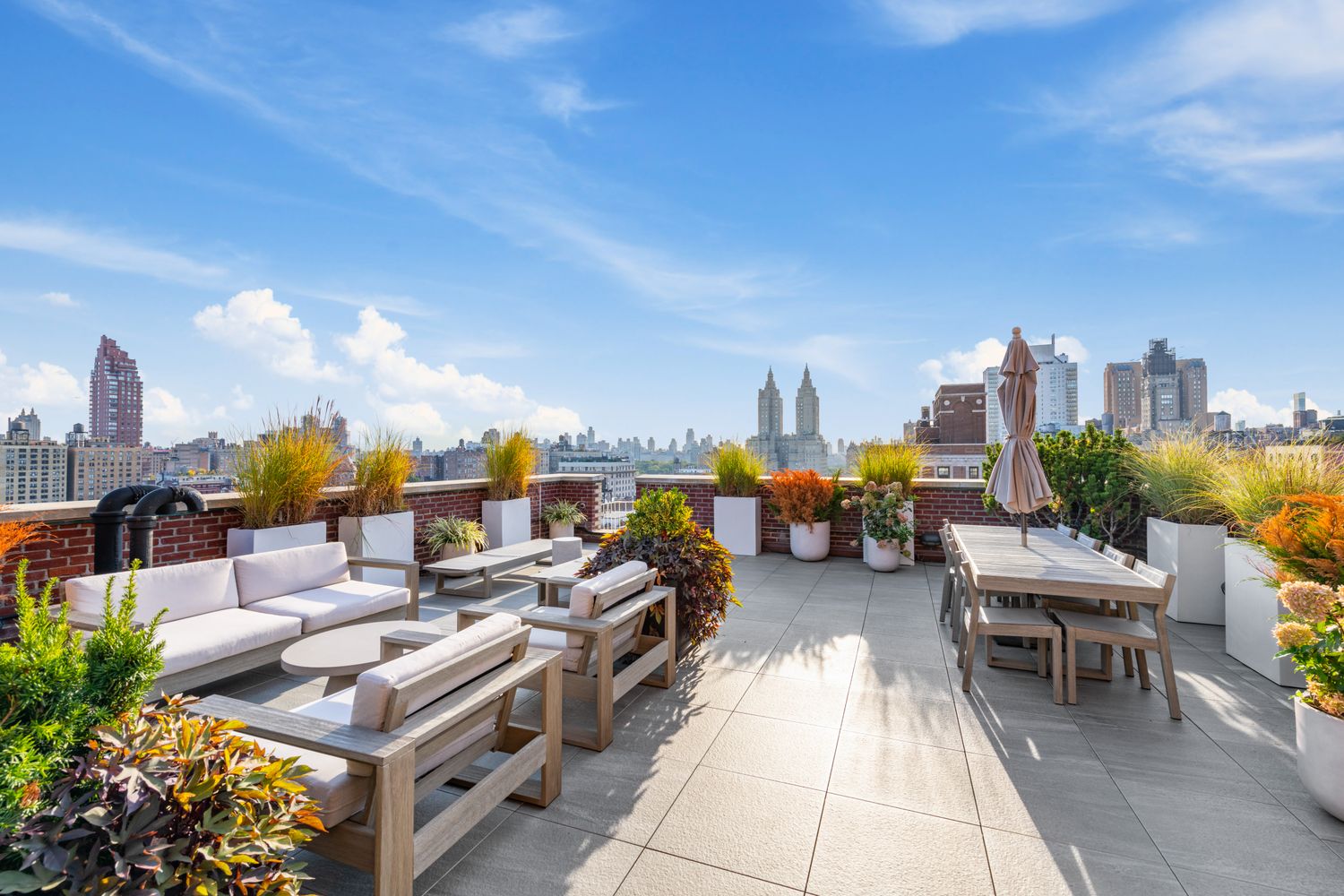 a view of a terrace with furniture and garden view