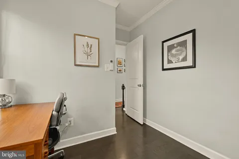 a view of room with window and wooden floor