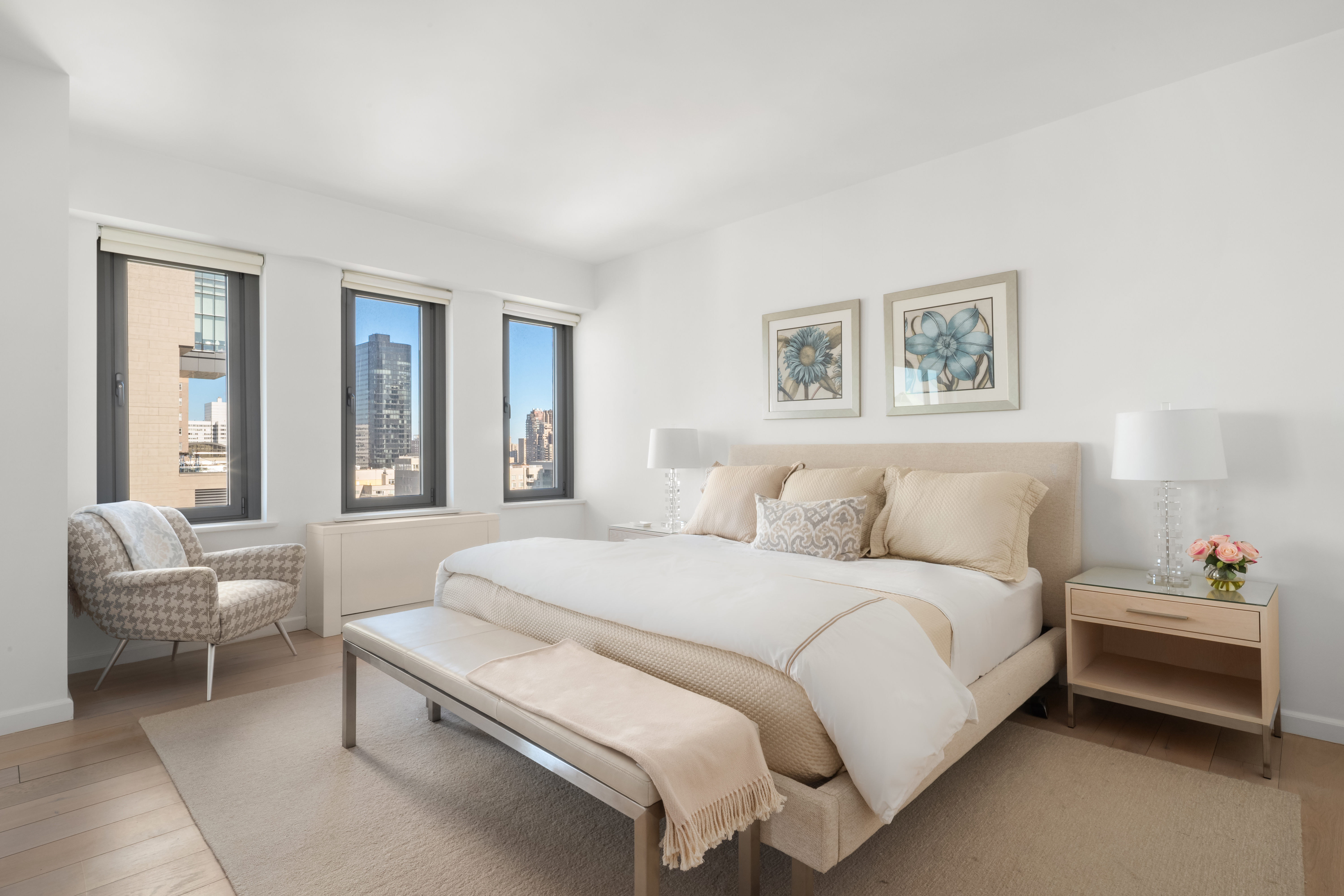 200 East 62nd Street, Unit 27A Manhattan, NY 10065 - Photo 7 of 19 a spacious bedroom with a bed and a couch