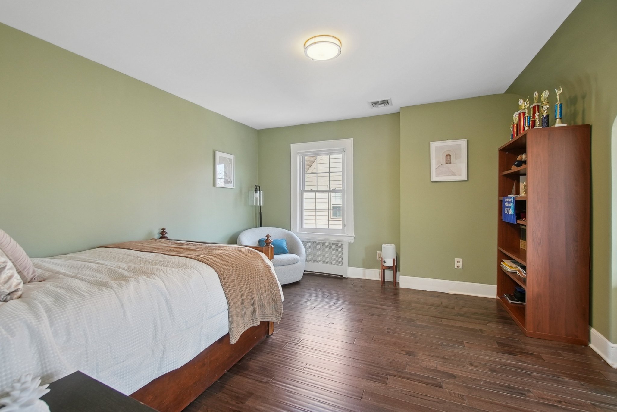 877 Ridgewood Road Millburn, NJ 07041 - Photo 24 of 37 a bedroom with a bed and wooden floor