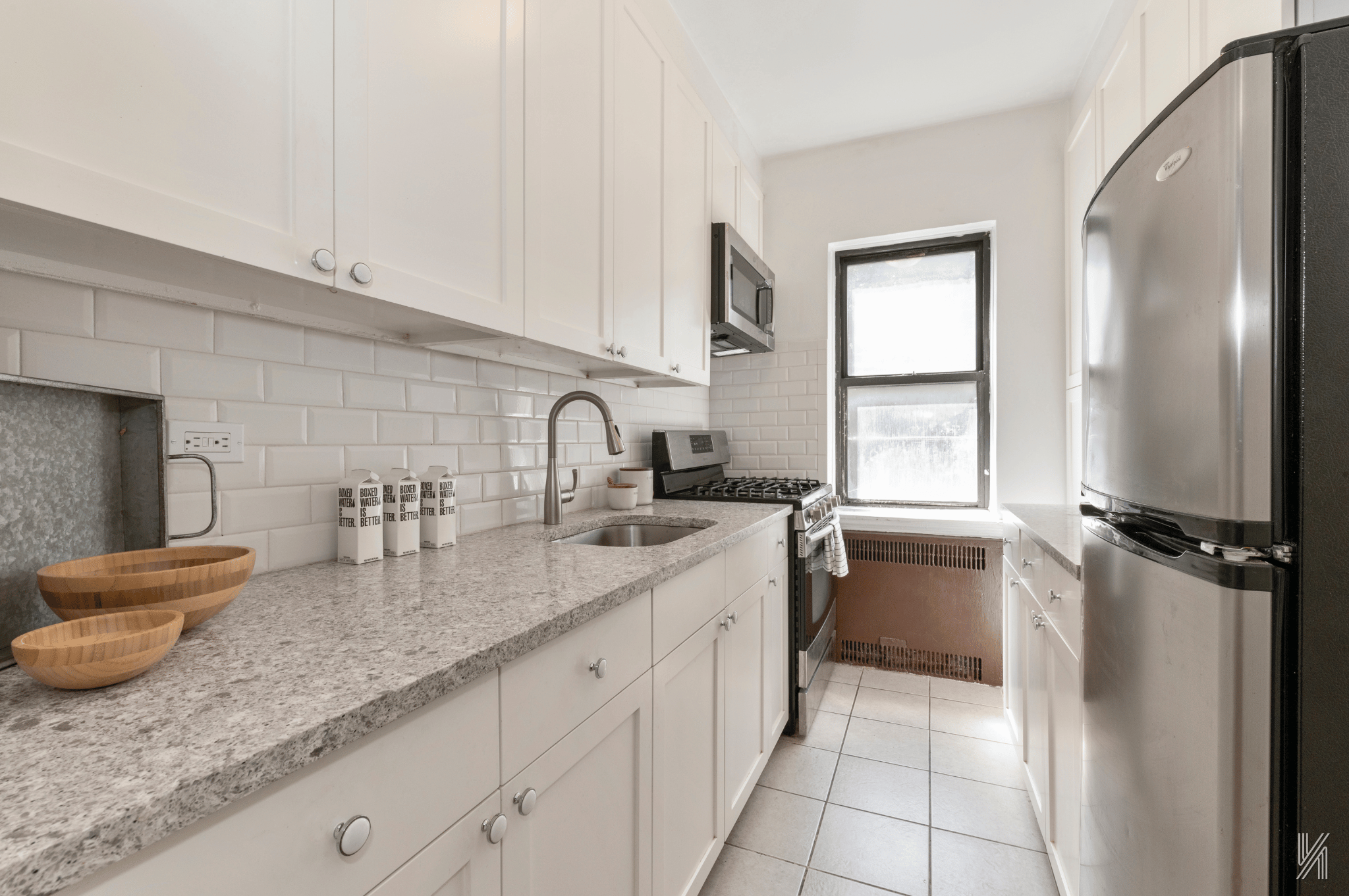 35-35 75th Street, Unit 428 Queens, NY 11372 - Photo 10 of 21 a kitchen with sink cabinets and window