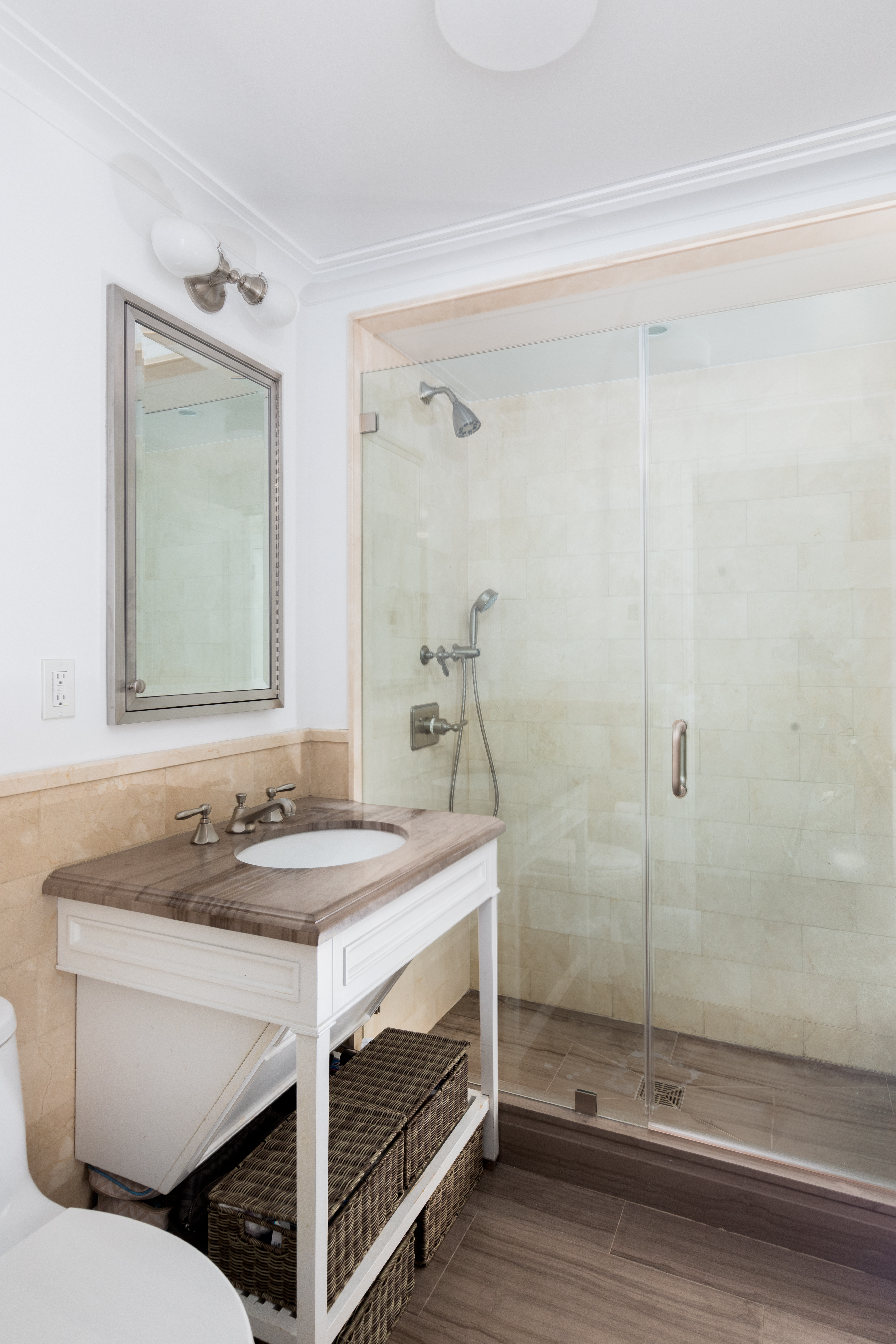 530 Park Avenue, Unit 7G Manhattan, NY 10065 - Photo 10 of 16 a bathroom with a sink and a mirror