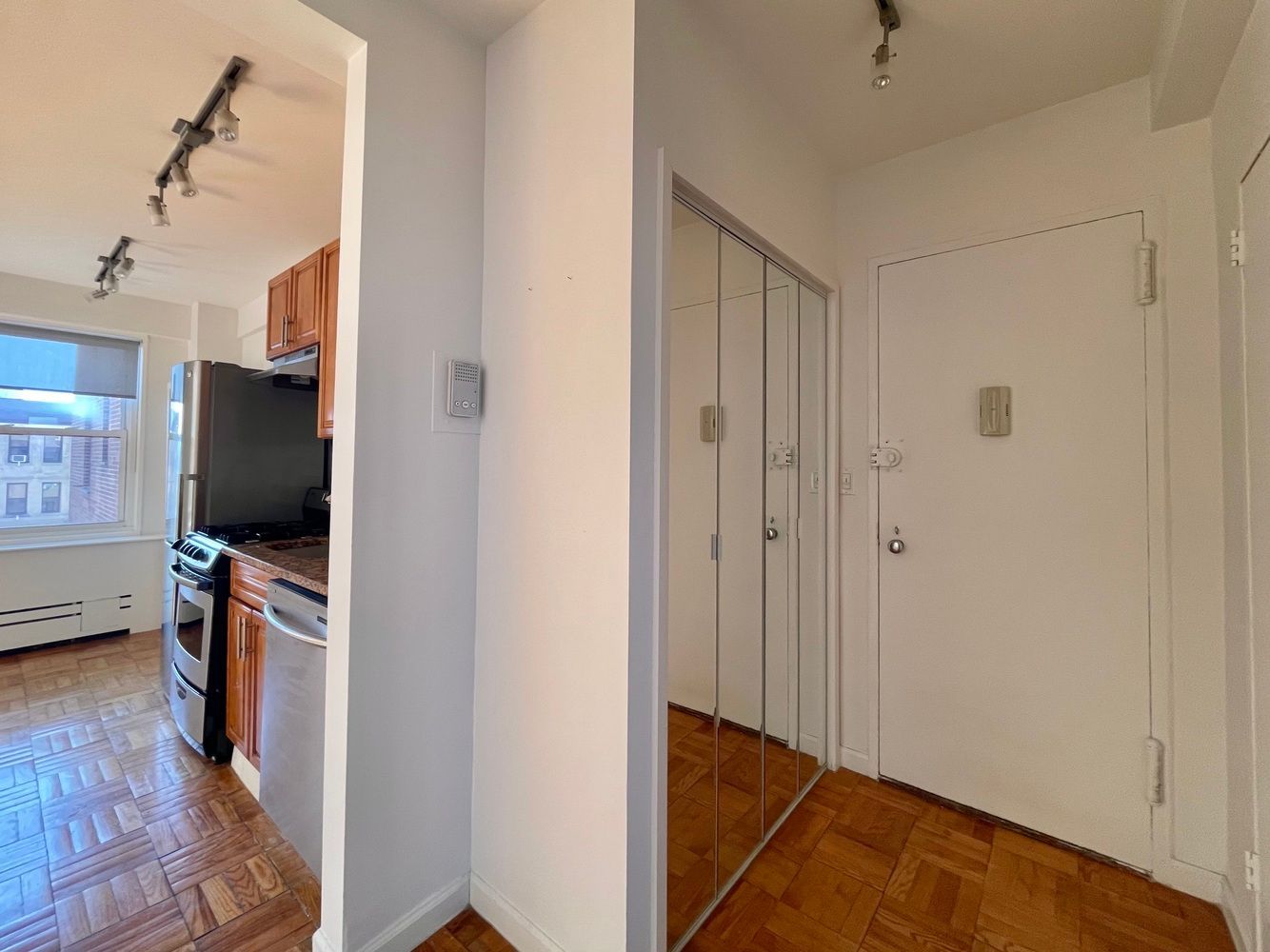 345 West 145th Street, Unit 8A1 Manhattan, NY 10031 - Photo 5 of 7 a view of a livingroom with wooden floor and a flat screen tv
