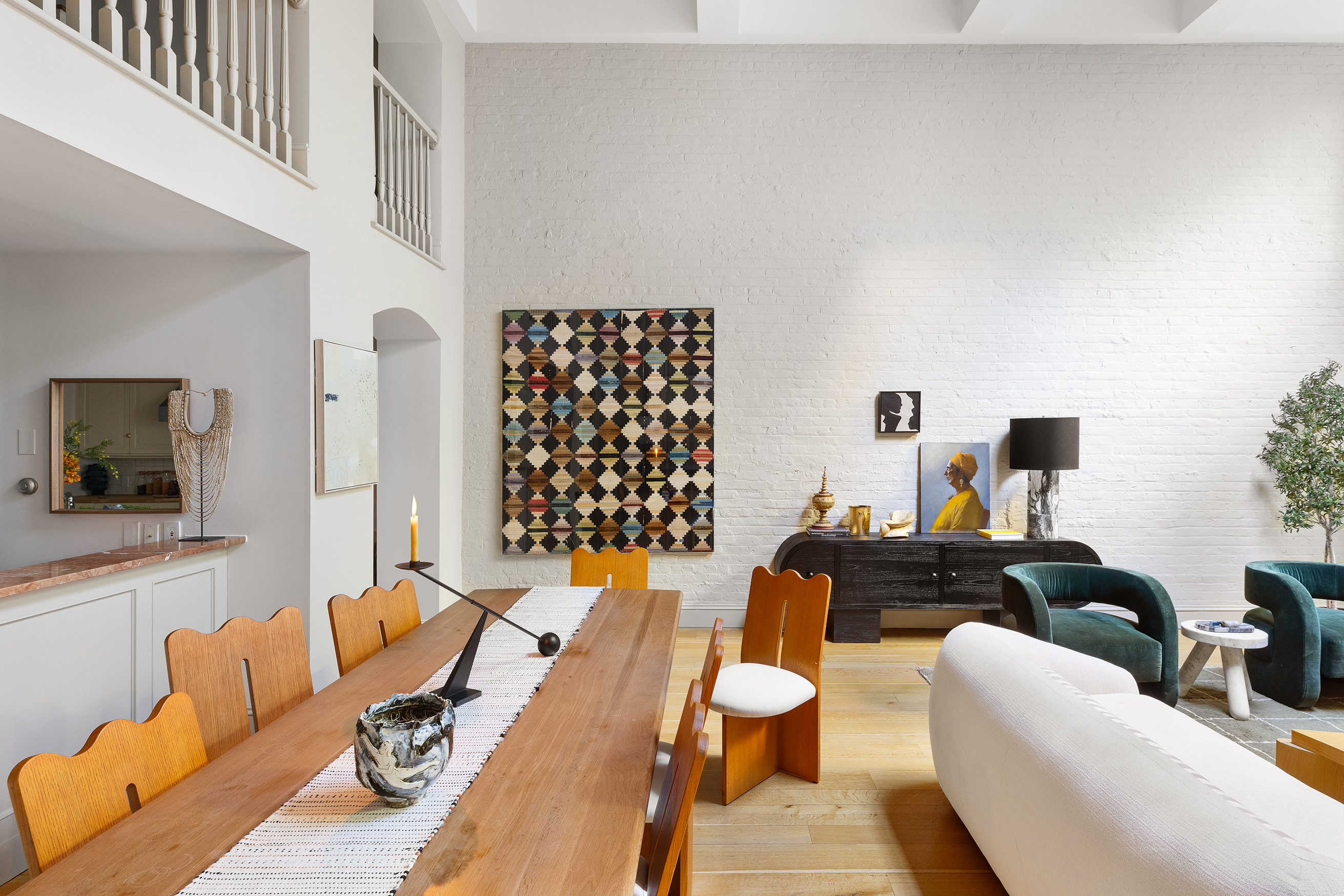 313 West 20th Street Manhattan, NY 10011 - Photo 5 of 20 a living room with furniture and a flat screen tv