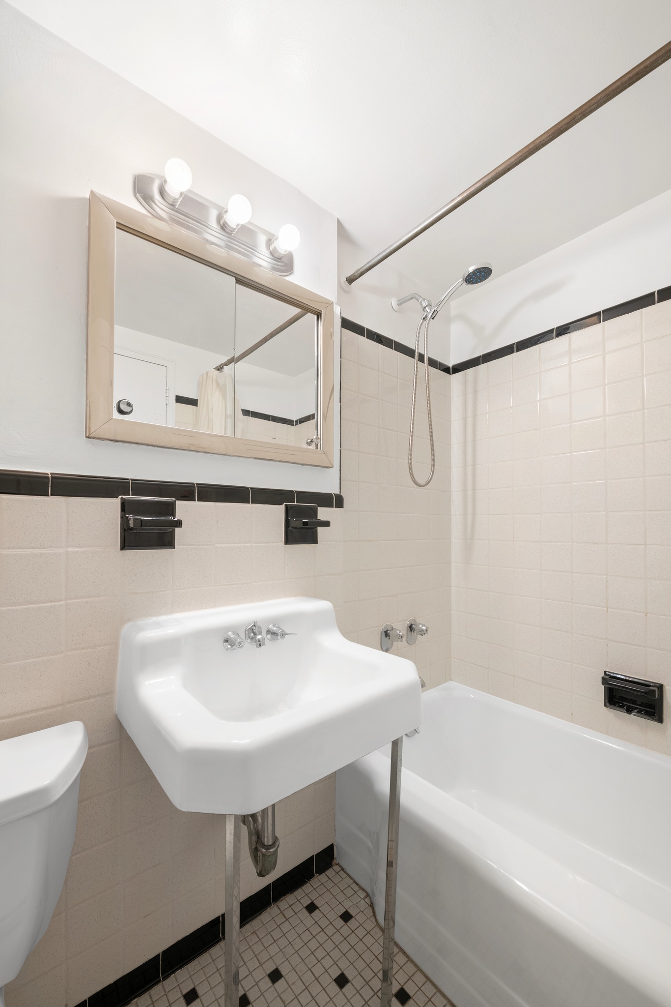 230 East 15th Street, Unit 7P Manhattan, NY 10003 - Photo 5 of 8 a bathroom with a sink a toilet and shower