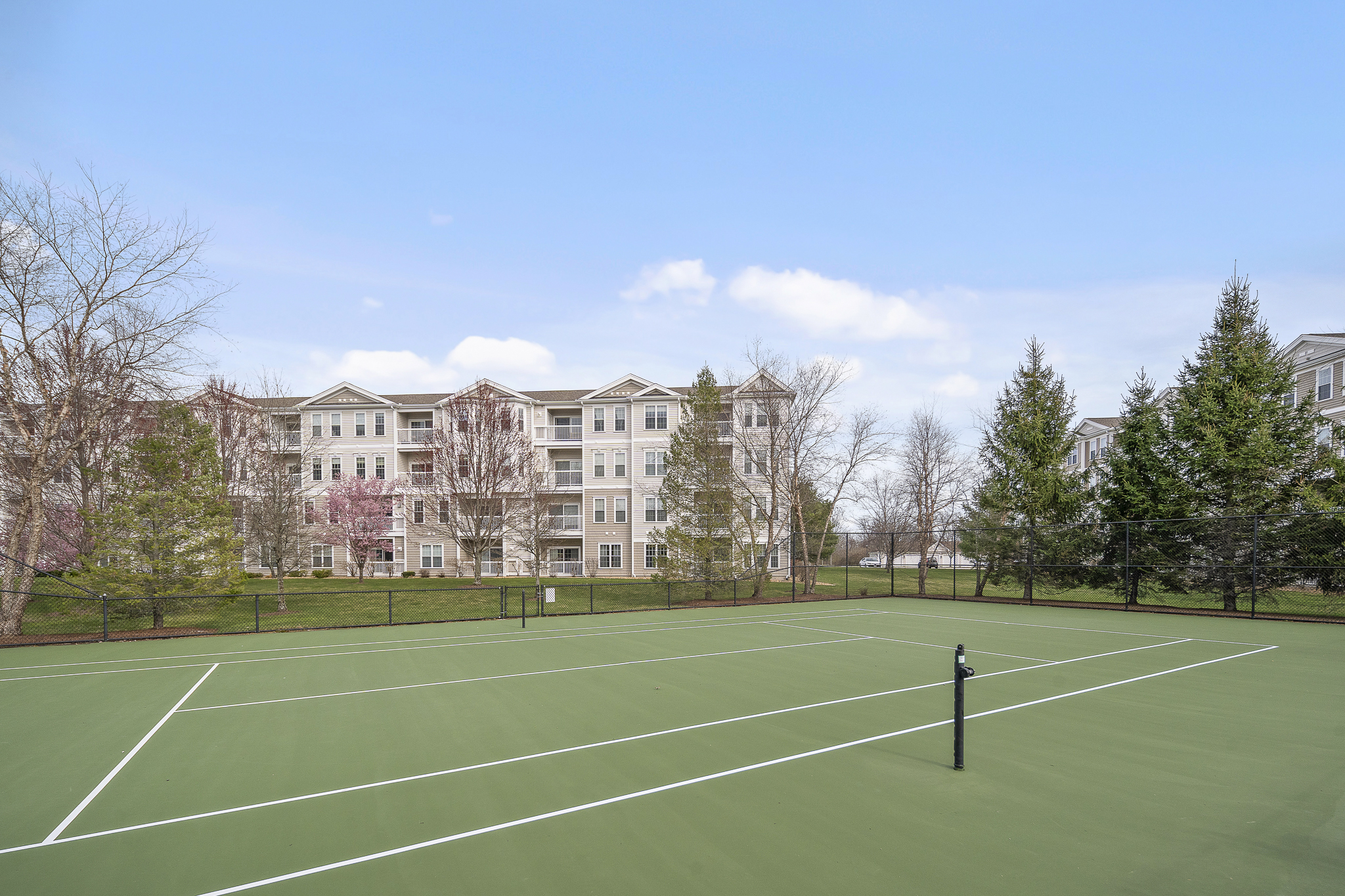 107 Clocktower Drive, Unit 407 Waltham, MA 02452 - Photo 18 of 19 a view of a tennis court