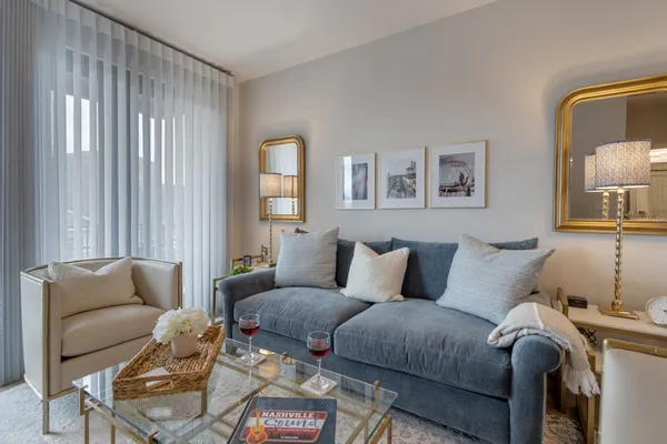 a living room with furniture and a window