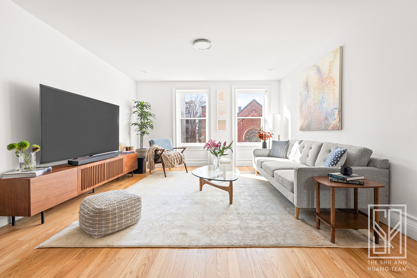 475 Washington Avenue, Unit 4I Brooklyn, NY 11238 - Photo 3 of 10 a living room with furniture and a flat screen tv