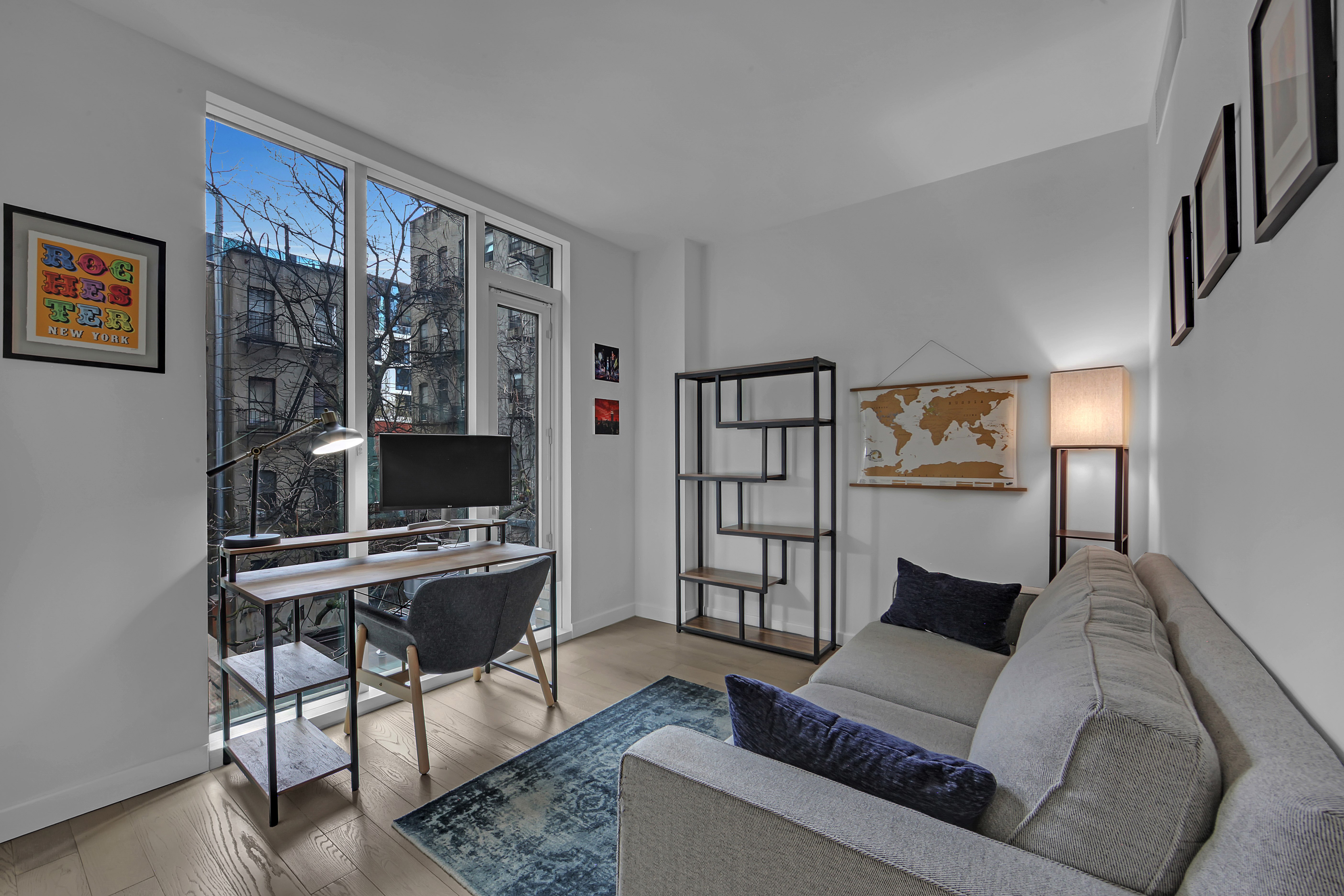 505-513 West 43rd Street, Unit 3M Manhattan, NY 10036 - Photo 10 of 20 a living room with furniture a rug and a window