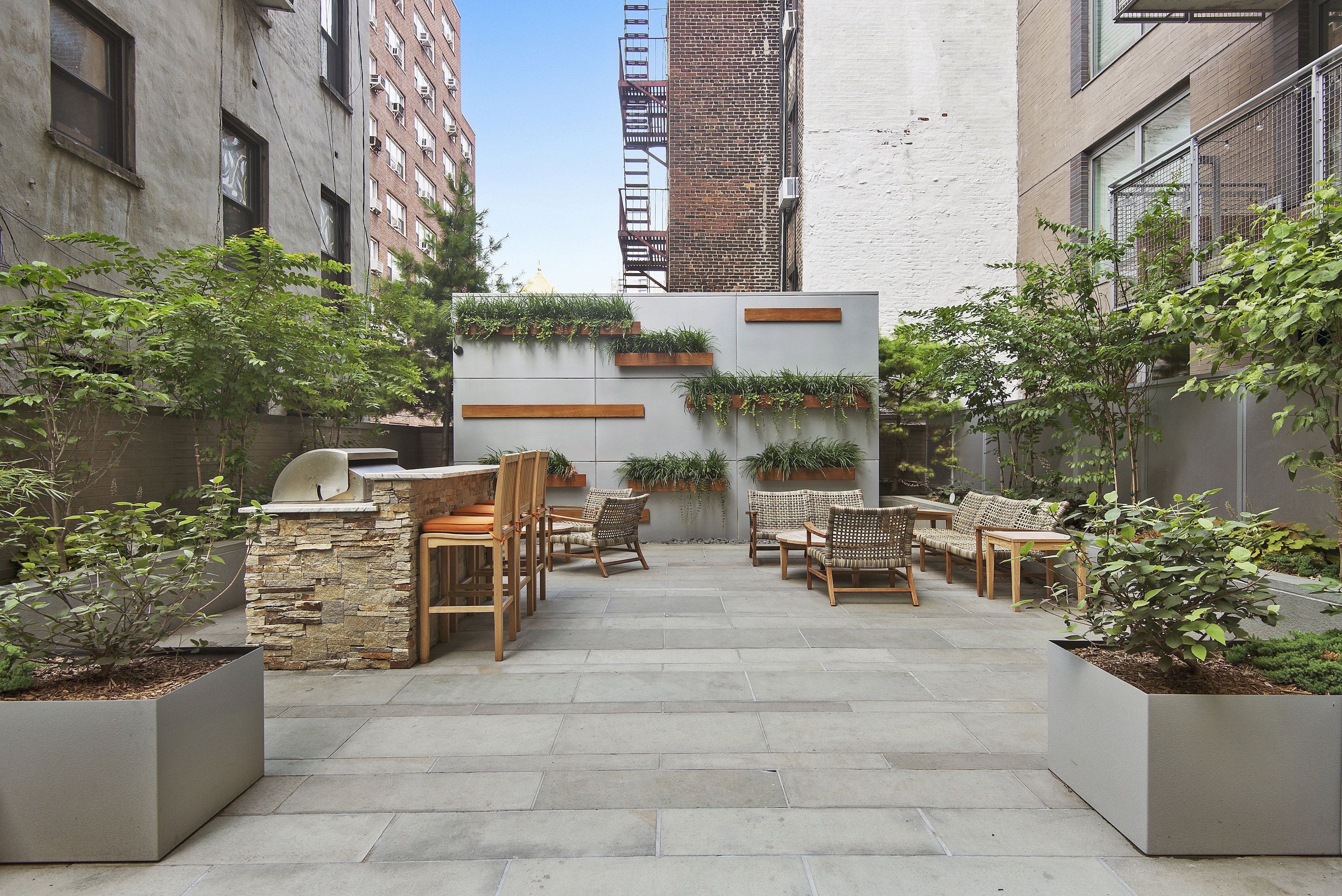 225 East 34th Street, Unit 3K Manhattan, NY 10016 - Photo 12 of 19 a view of a patio with table and chairs and potted plants