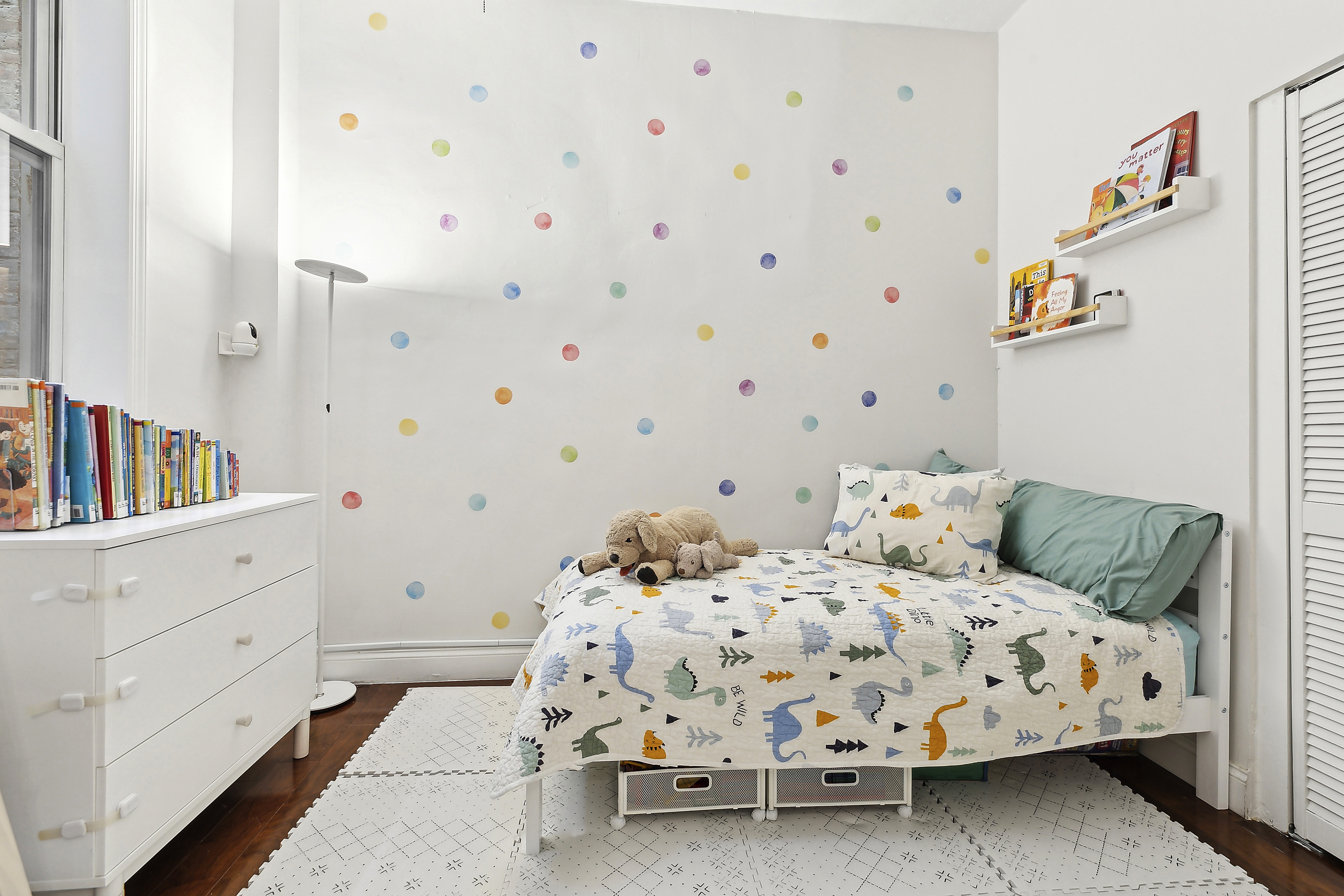 406 West 46th Street, Unit 4C Manhattan, NY 10036 - Photo 5 of 9 a bedroom with two beds and a dresser