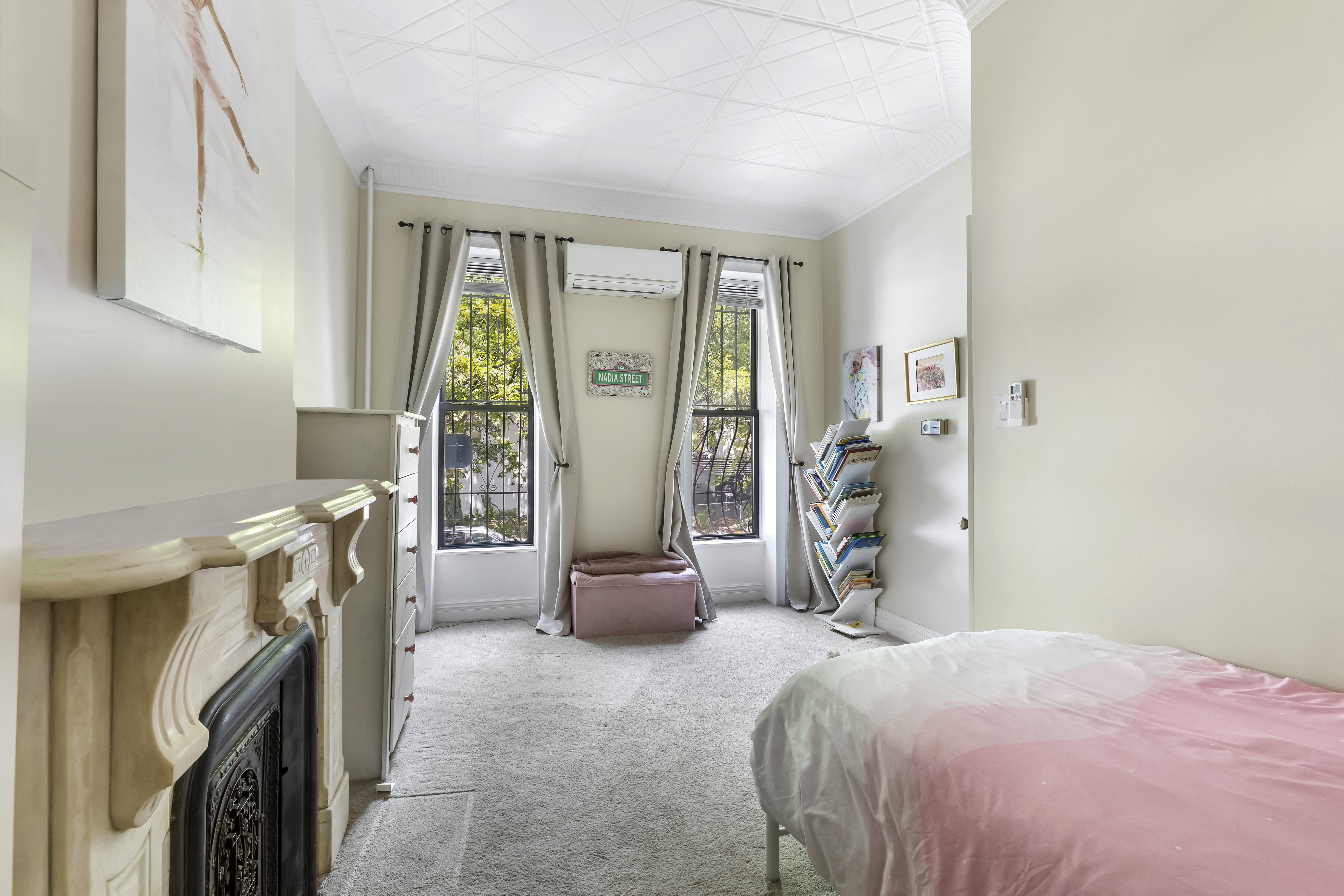 312 10th Street Brooklyn, NY 11215 - Photo 15 of 17 a bedroom with a bed and a window