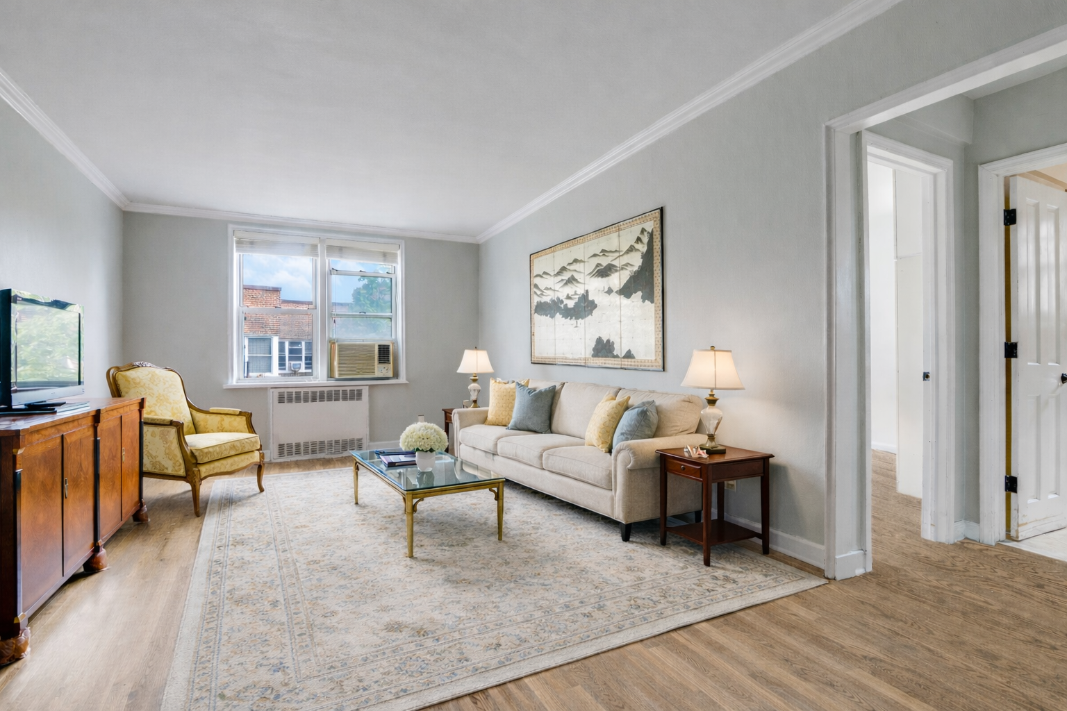 5614 Netherland Avenue, Unit 4E Bronx, NY 10471 - Photo 2 of 8 a living room with furniture or couch and a window