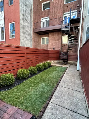 a view of a house with a small yard and a large window
