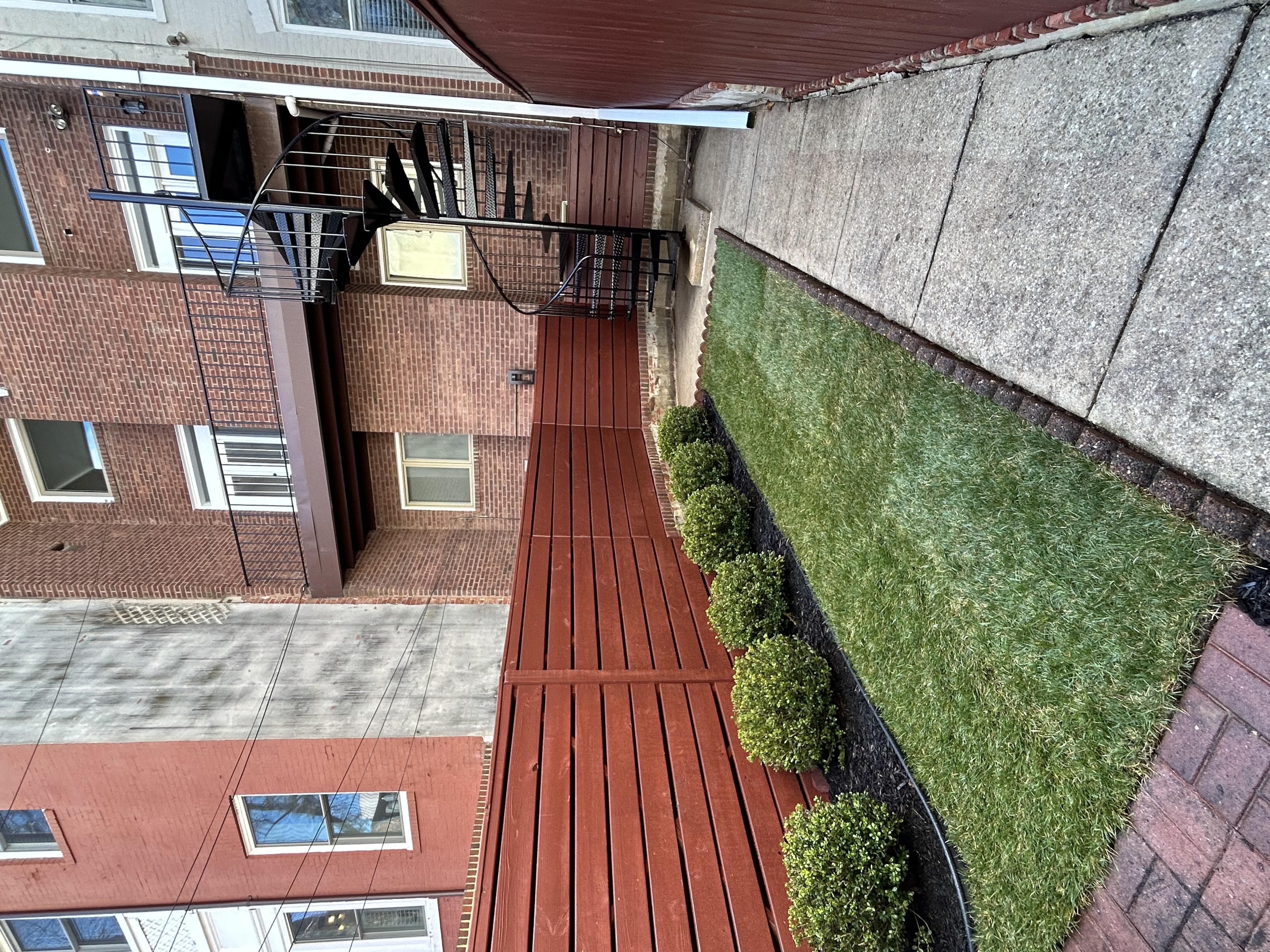 1823 16th Street Northwest, Unit 2 Washington, DC 20009 - Photo 14 of 19 a view of a house with a small yard and a large window