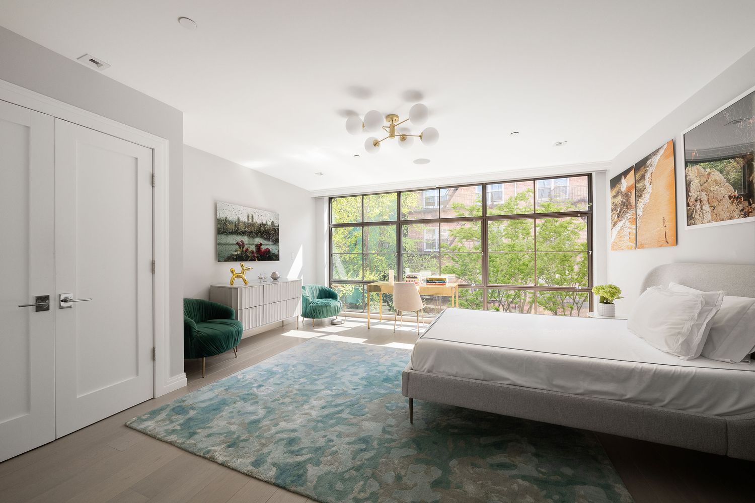 520 East 89th Street Manhattan, NY 10128 - Photo 23 of 40 a living room with furniture and a large window