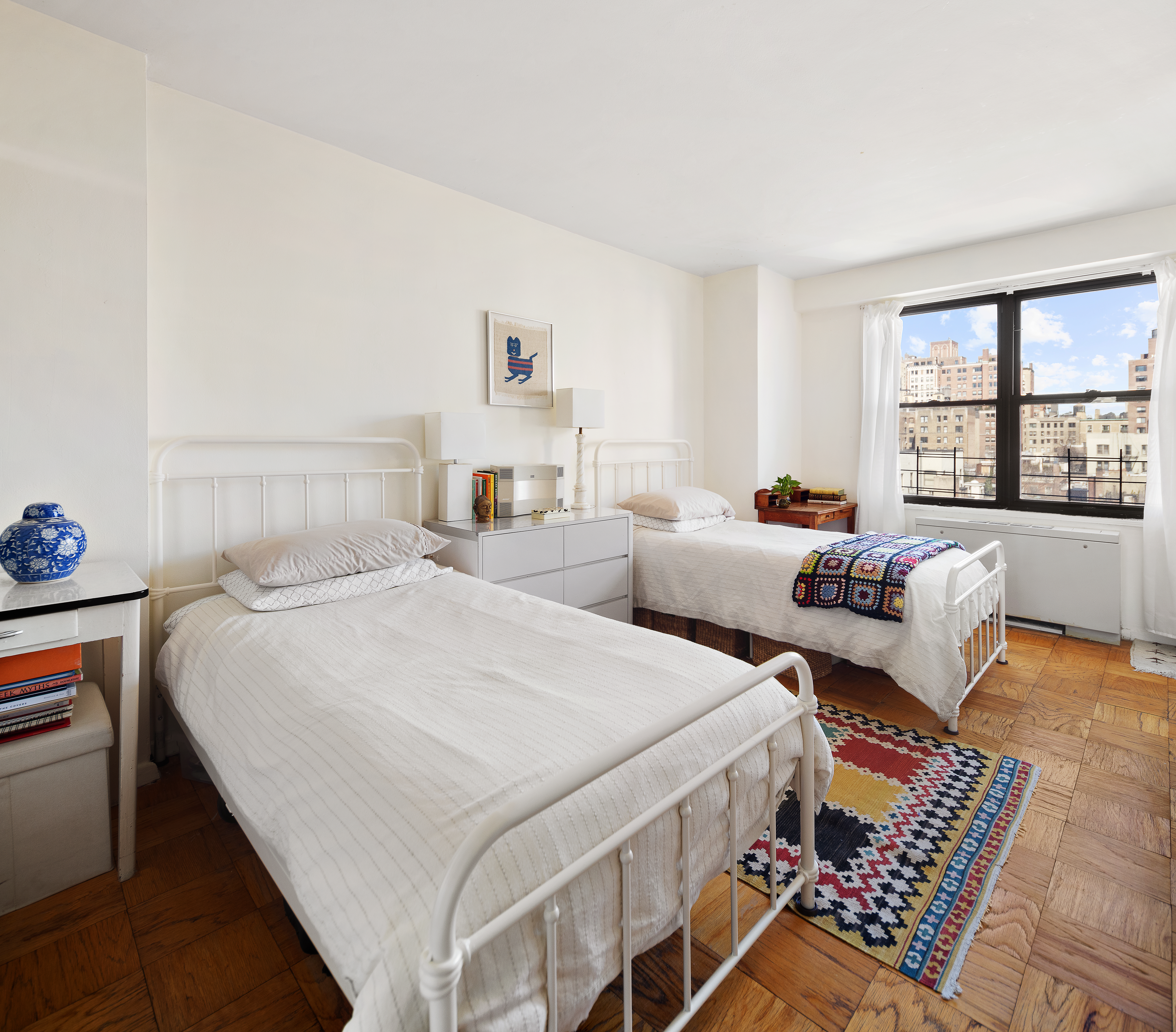 120 East 90th Street, Unit 9E Manhattan, NY 10128 - Photo 7 of 9 a bedroom with two beds and a couch