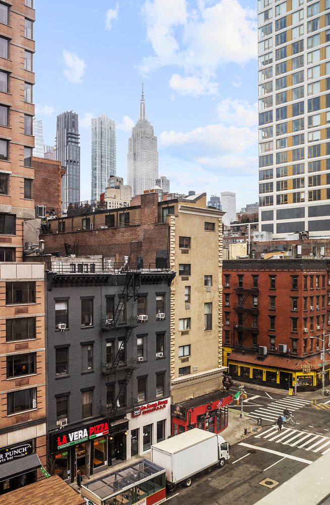 201 East 25th Street, Unit 7F Manhattan, NY 10010 - Photo 4 of 9 a city view with tall buildings
