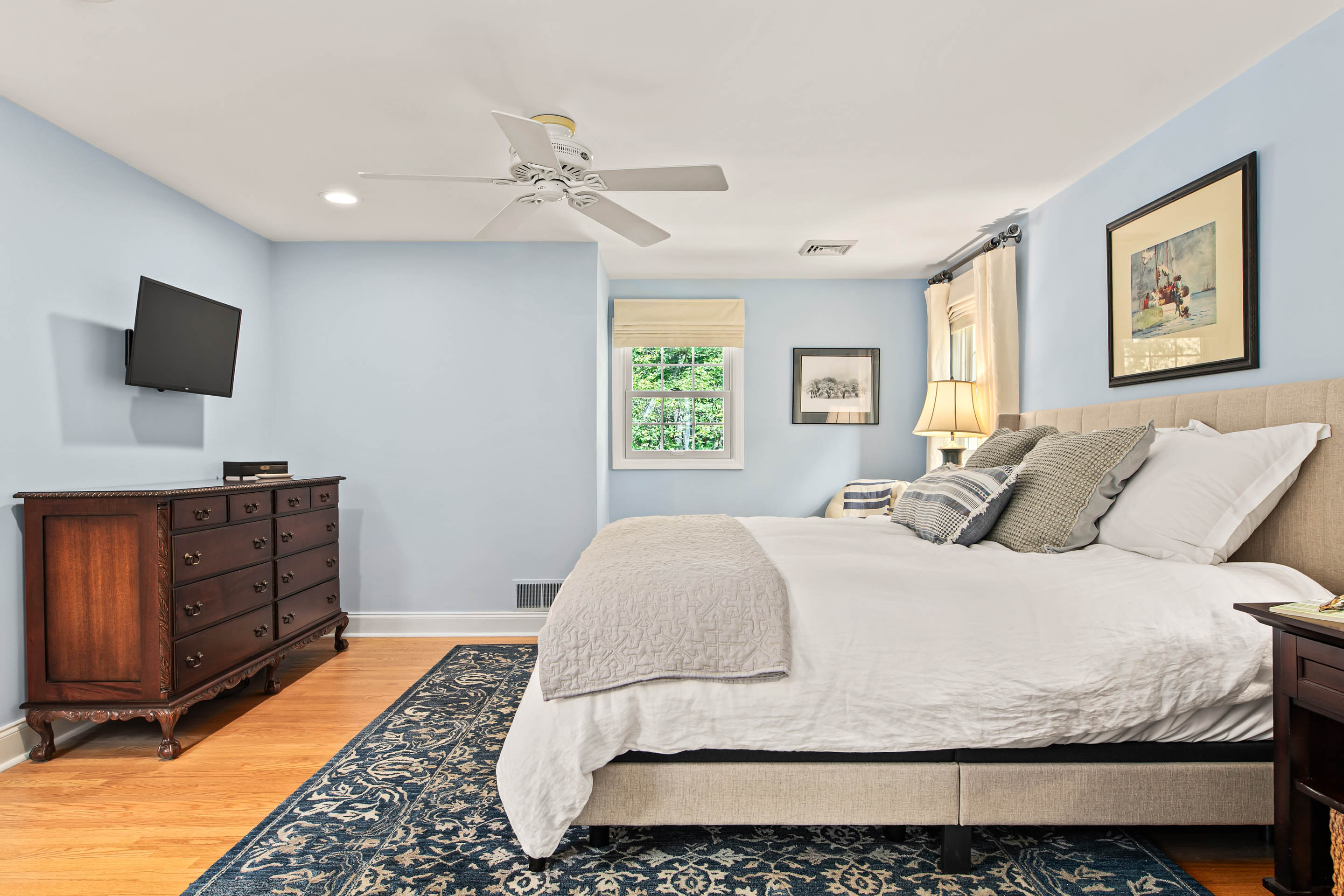 1136 Seaton Ross Road Wayne, PA 19087 - Photo 23 of 48 a bedroom with a large bed and a flat screen tv