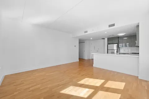 a view of kitchen and kitchen with stainless steel appliances