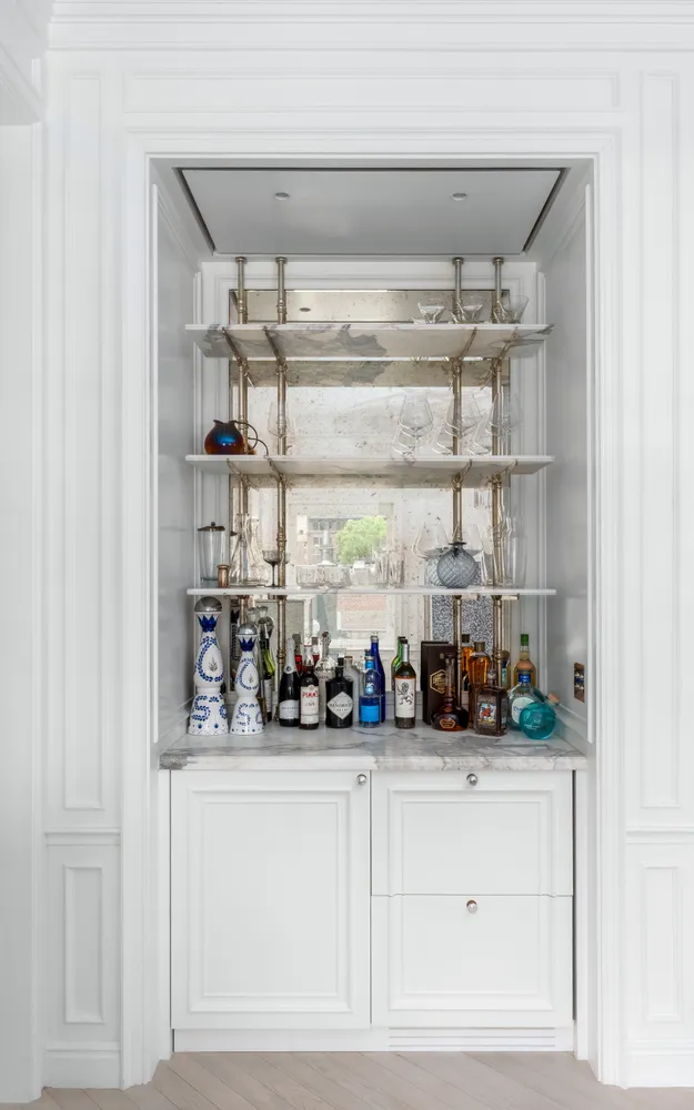 a kitchen with a refrigerator and cabinets