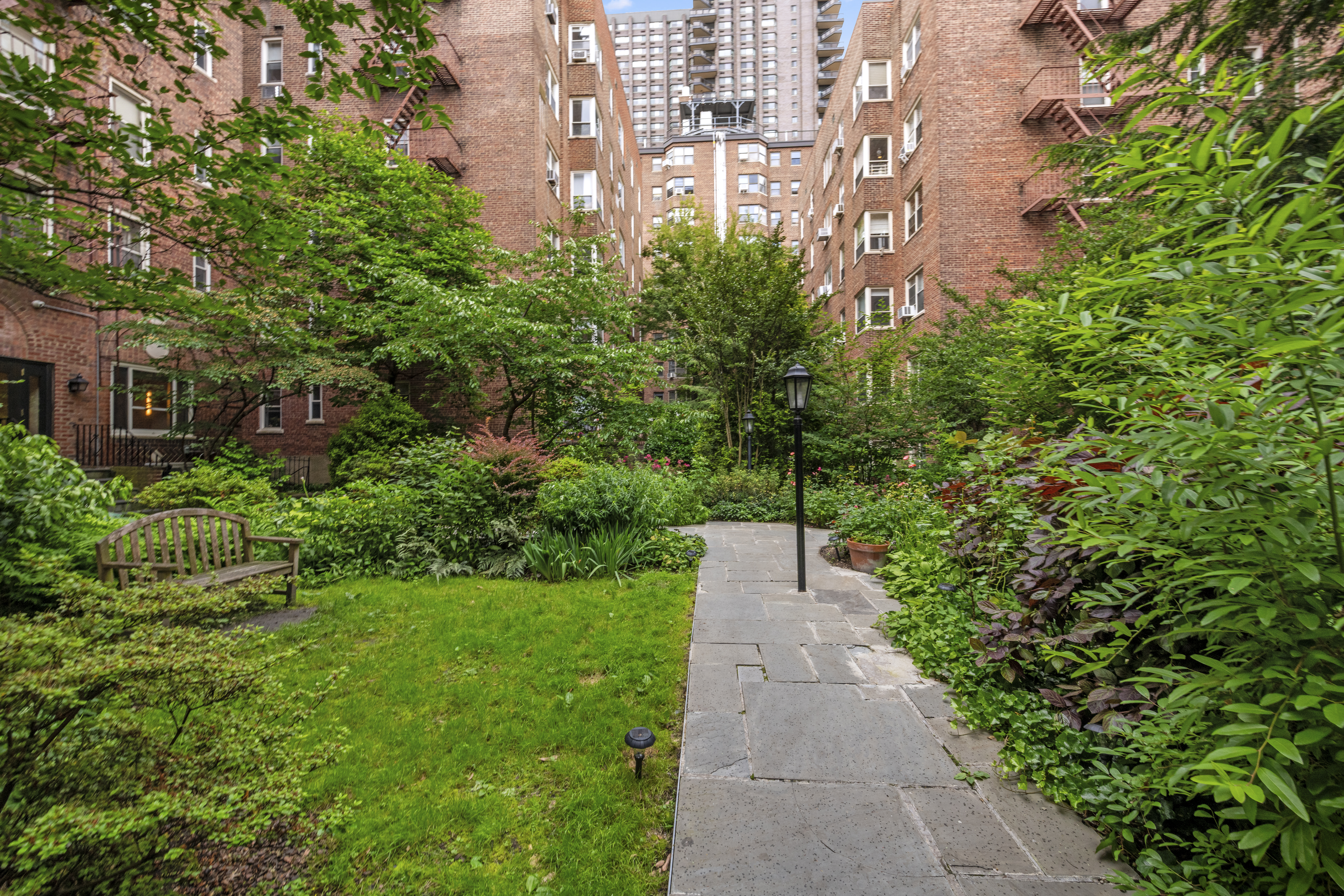 515 East 89th Street, Unit 2E Manhattan, NY 10128 - Photo 15 of 17 a view of a pathway both side of house