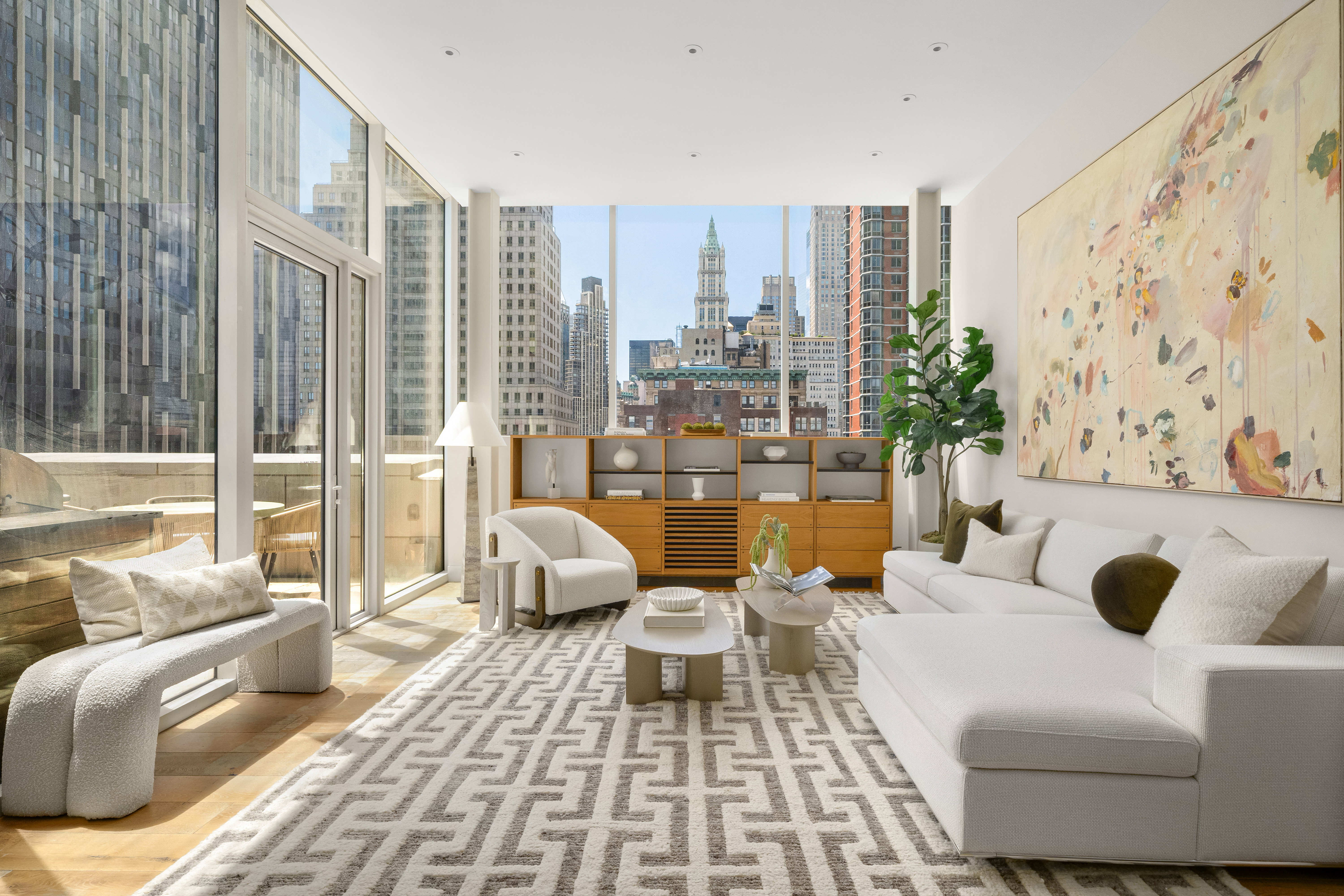 93 Worth Street, Unit PH5 Manhattan, NY 10013 - Photo 1 of 19 a living room with furniture and a large window