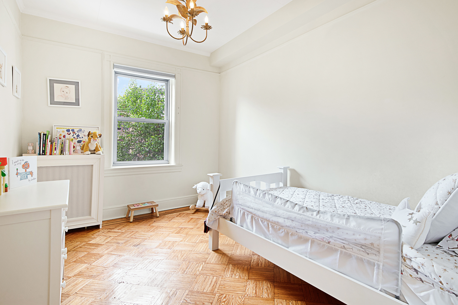 392 9th Street Brooklyn, NY 11215 - Photo 7 of 11 a bed room with a bed and a chair