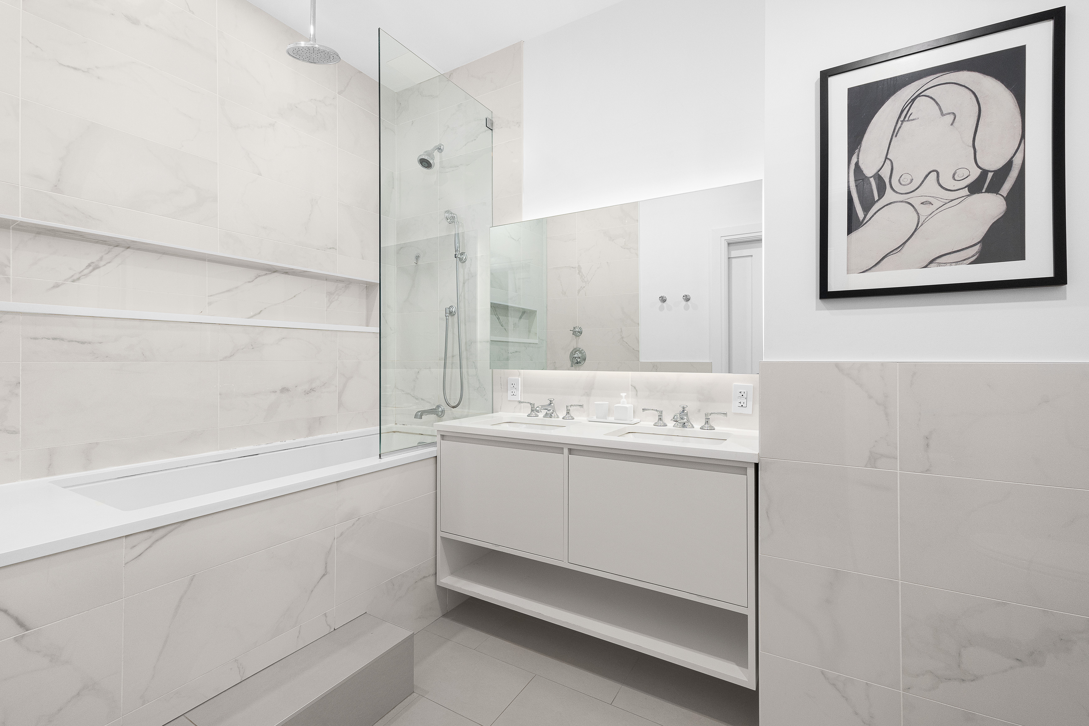 77 Bleecker Street, Unit 123E Manhattan, NY 10012 - Photo 7 of 13 a bathroom with a bathtub and a shower