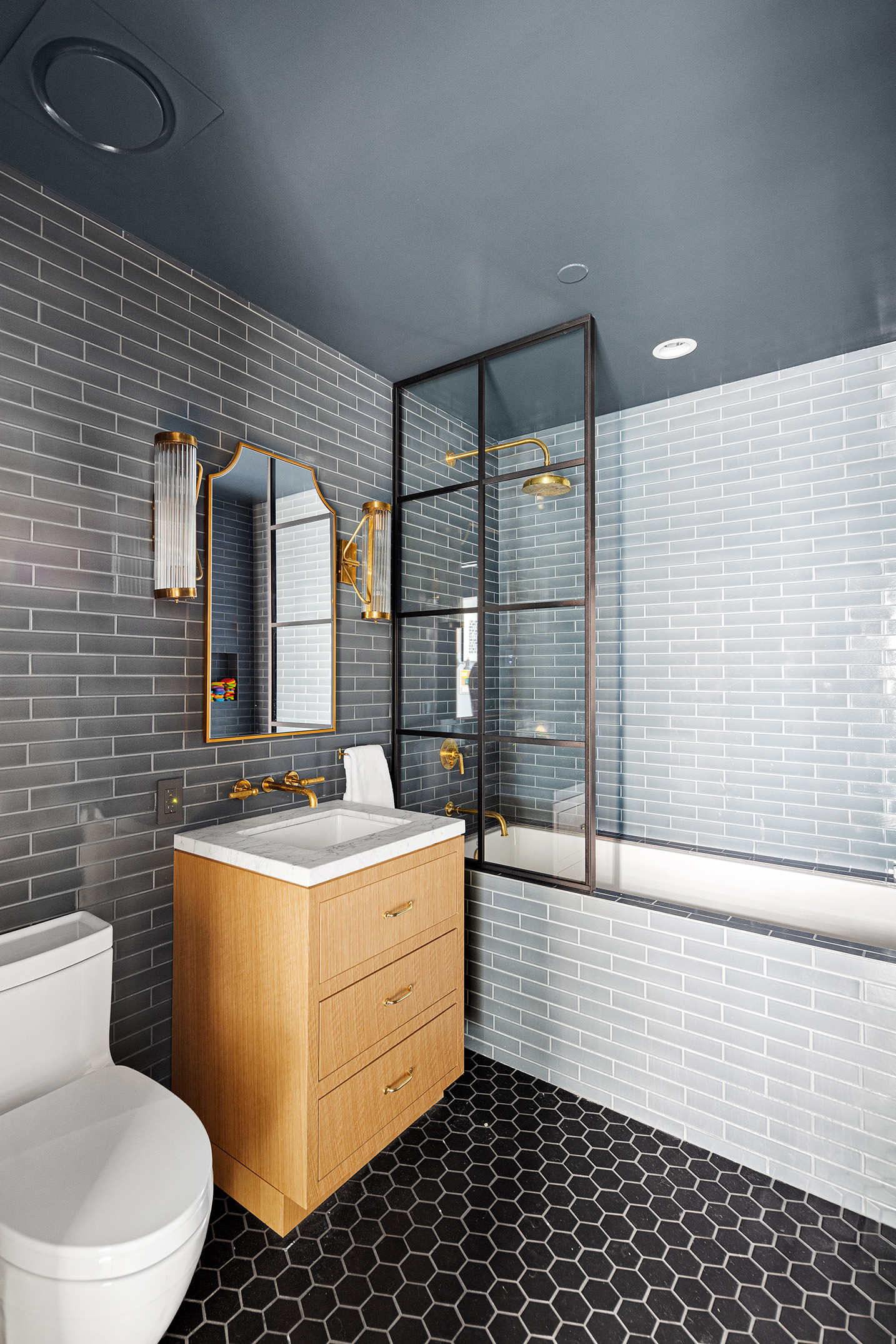 35 Mercer Street, Unit 3E Manhattan, NY 10013 - Photo 18 of 21 a bathroom with a sink toilet mirror and shower