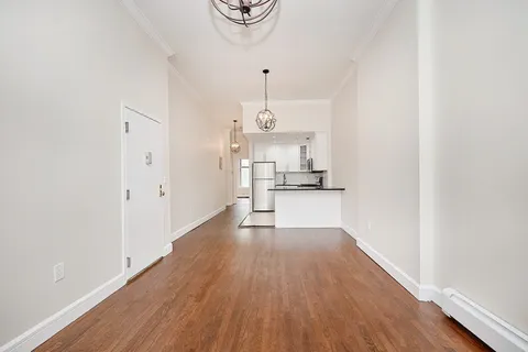 a view of kitchen with wooden floor