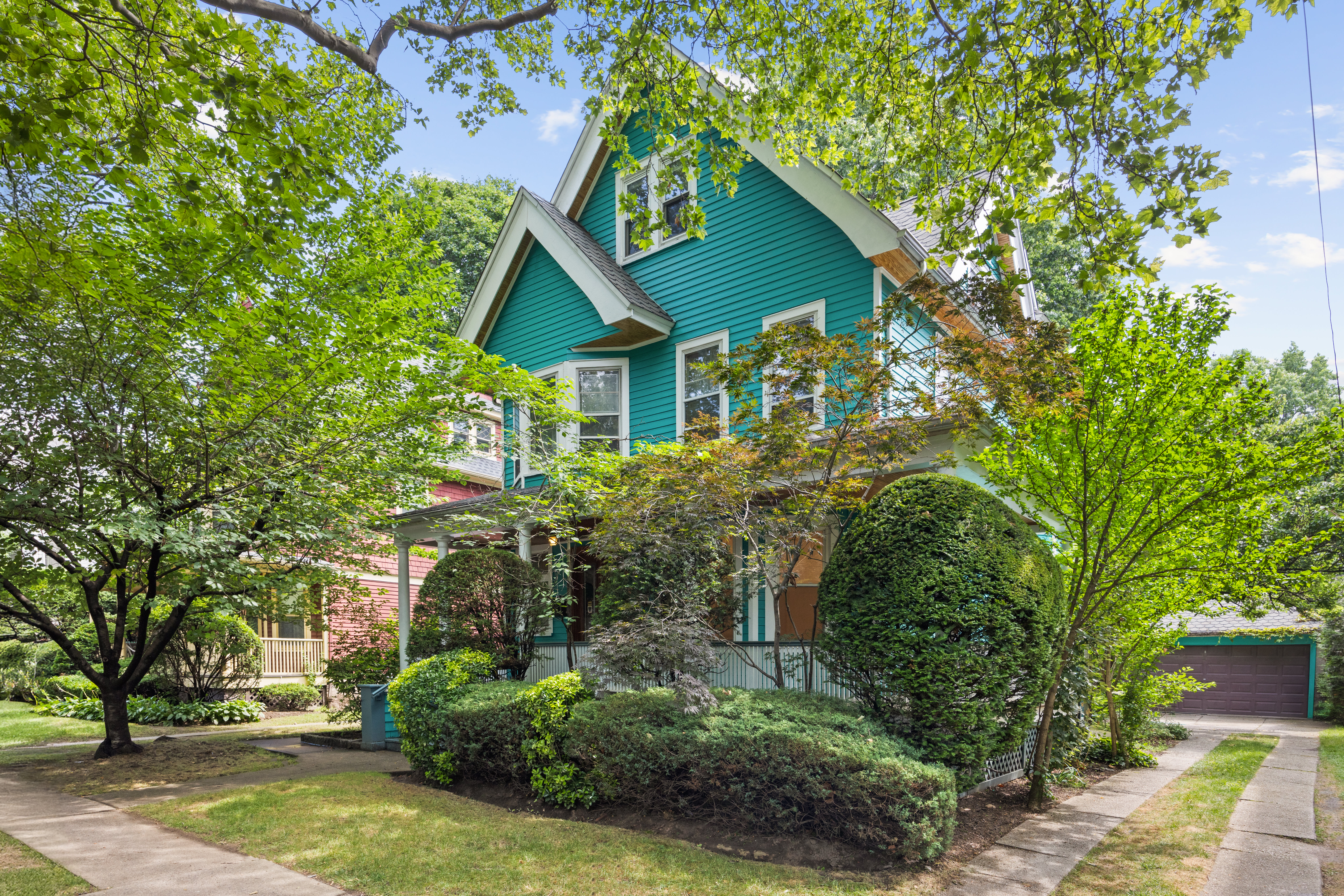 215 Stratford Road, Unit 1 Brooklyn, NY 11218 - Photo 5 of 9 a yellow house with trees in front of it