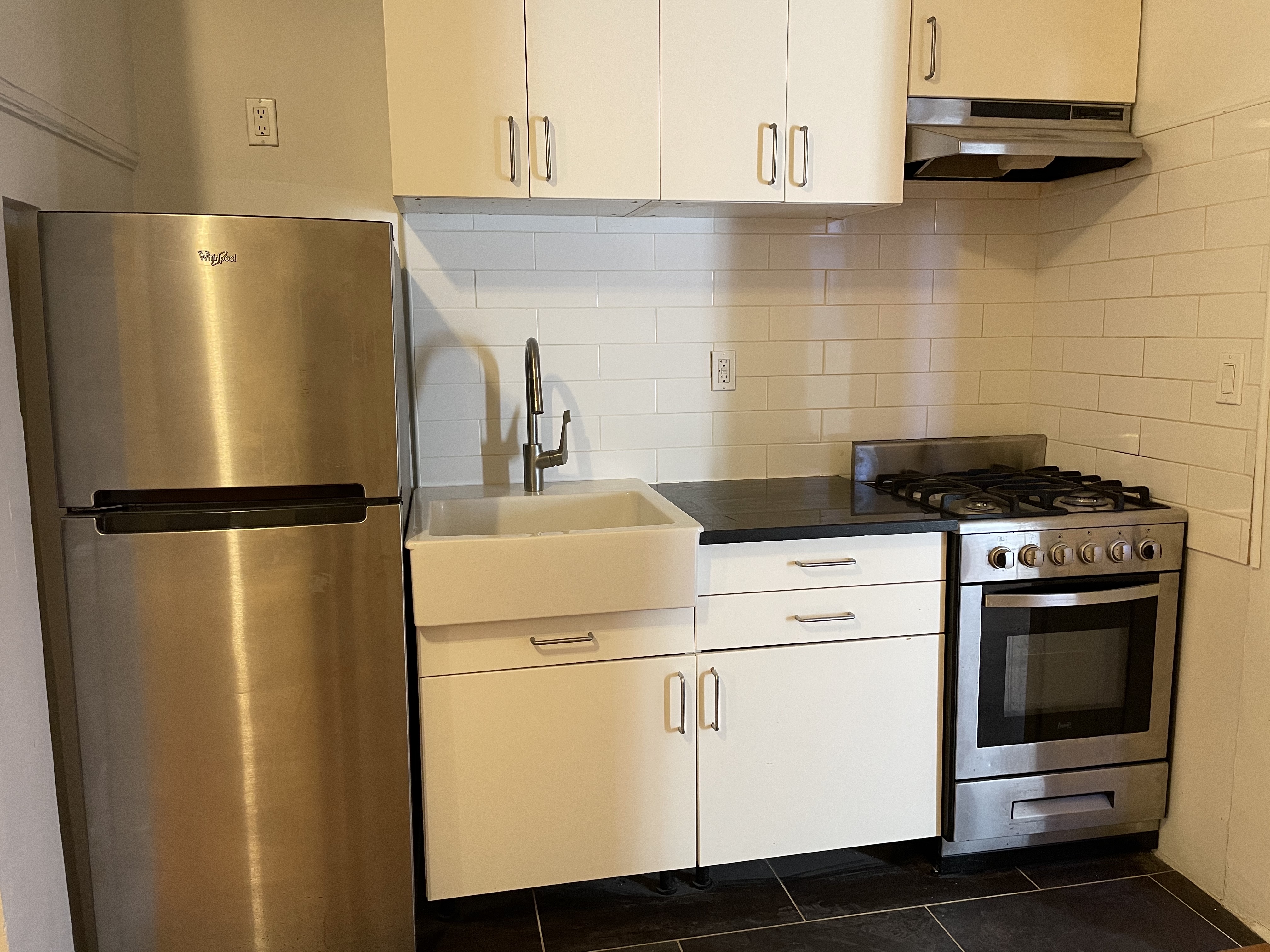 357 Sterling Place, Unit A2 Brooklyn, NY 11238 - Photo 5 of 8 a kitchen with metallic refrigerator and a stove
