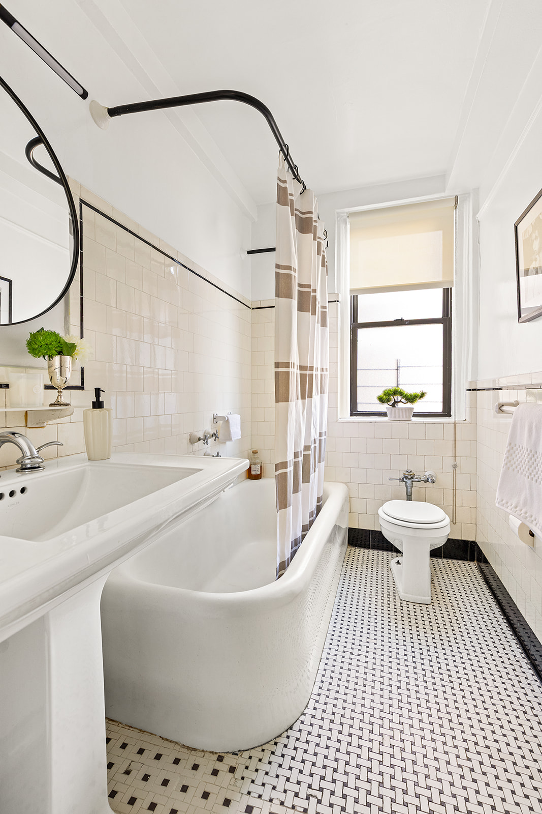 175 West 93rd Street, Unit 12K Manhattan, NY 10025 - Photo 5 of 10 a white bath tub sitting next to a white toilet