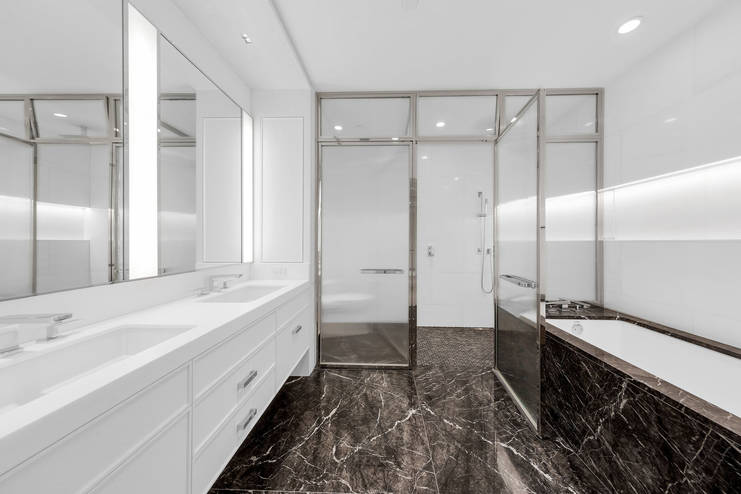 50 West 66th Street, Unit 17A Manhattan, NY 10023 - Photo 9 of 49 a bathroom with a double vanity sink and a mirror