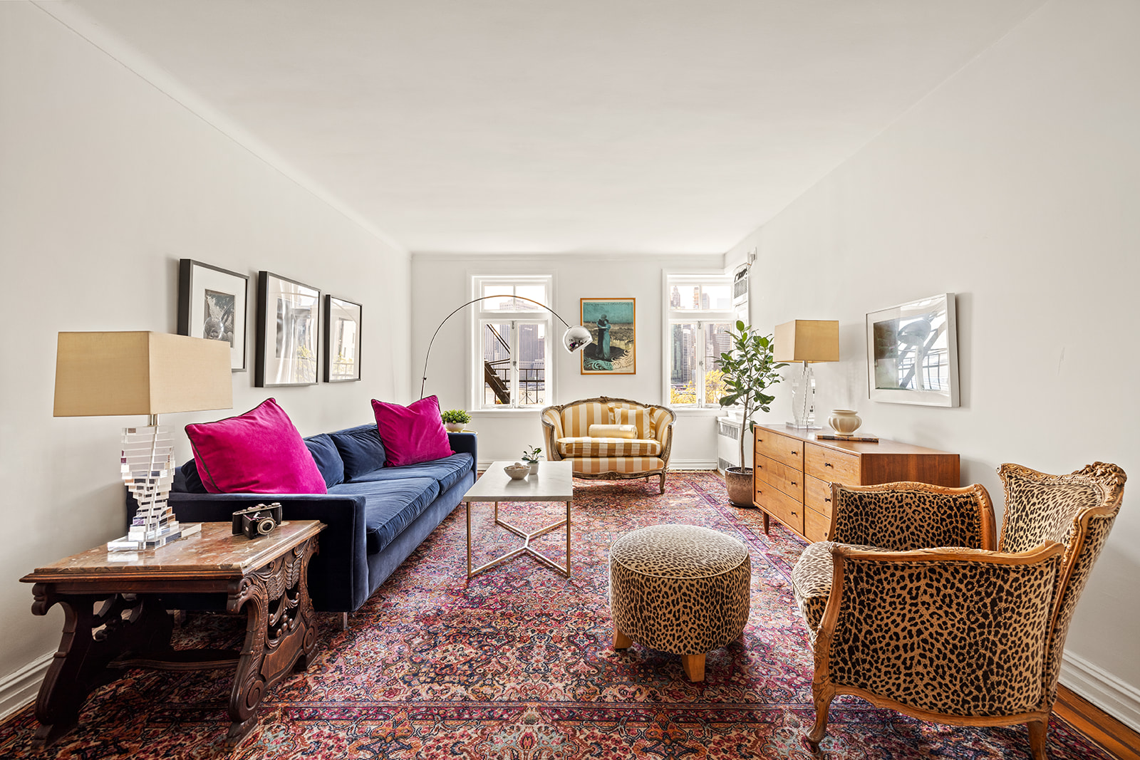 a living room with furniture and a table