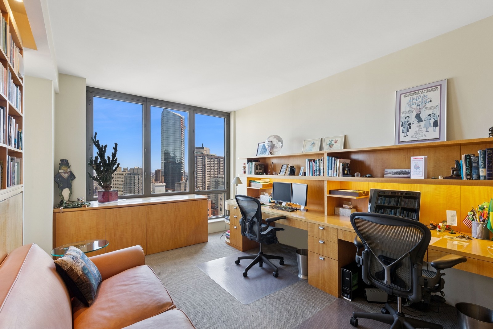 2 Columbus Avenue, Unit 35A Manhattan, NY 10023 - Photo 9 of 13 a work room with furniture and a window