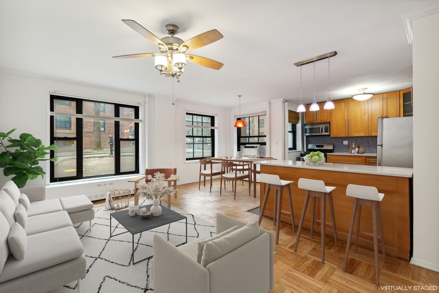 355 Clinton Avenue, Unit 1F Brooklyn, NY 11238 - Photo 1 of 14 a living room with fireplace furniture and a chandelier